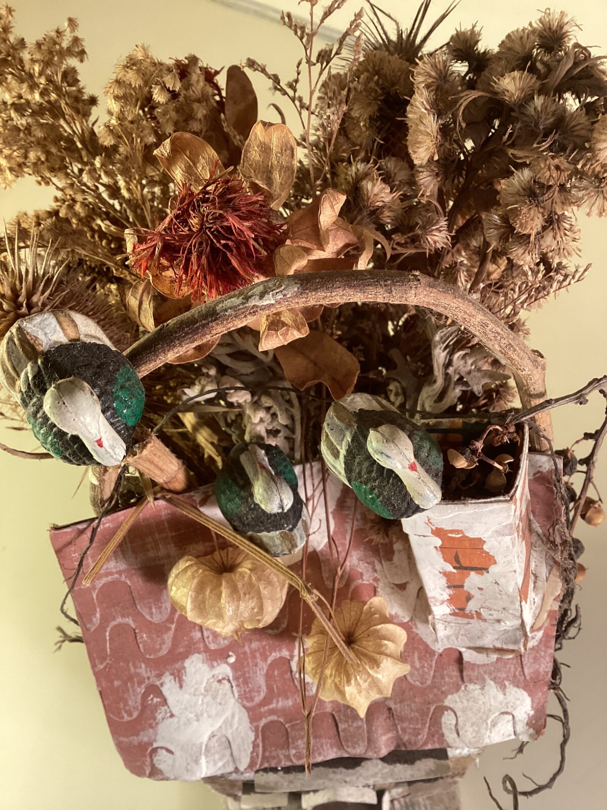 Wood birdhouse centerpiece with dried flowers, turkeys, twigs, windows, chimney