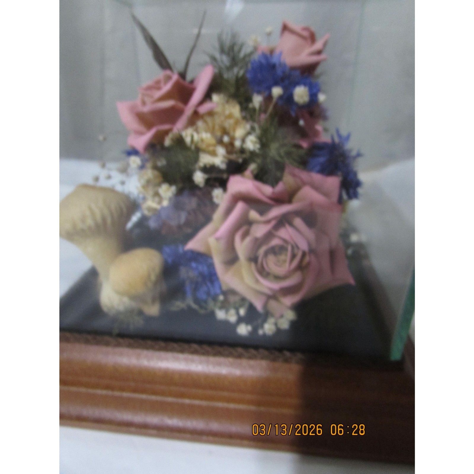 Vintage dried flower arrangement in glass with wood base butterfly mushrooms