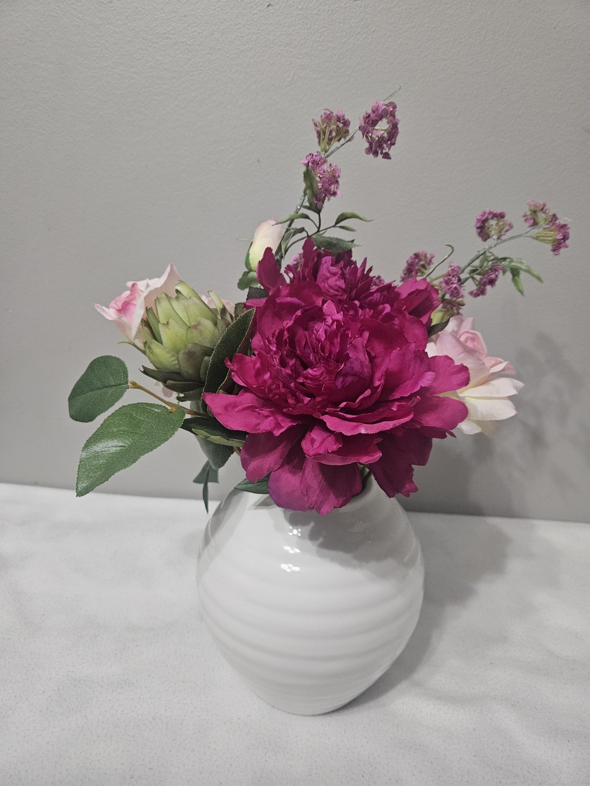 Vintage Flower Arrangements in White Ceramic Vase with Faux Water
