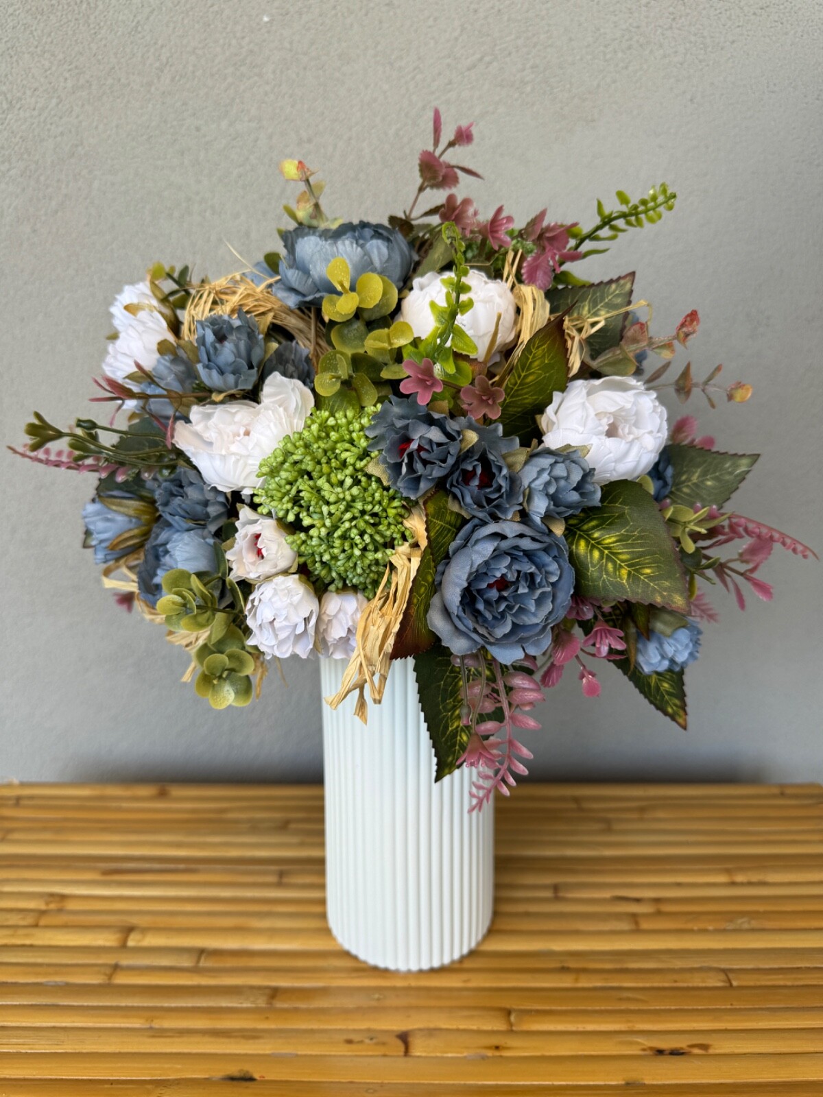 Blue and white flower arrangement in a vase , width 12’, height 15’, home decor.