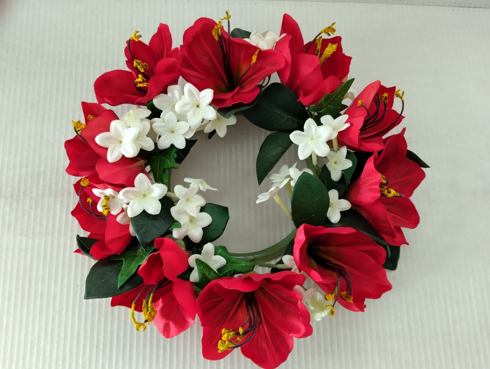 Bright red Amaryllis candle ring for a 6″ pillar candle or cremation urn.