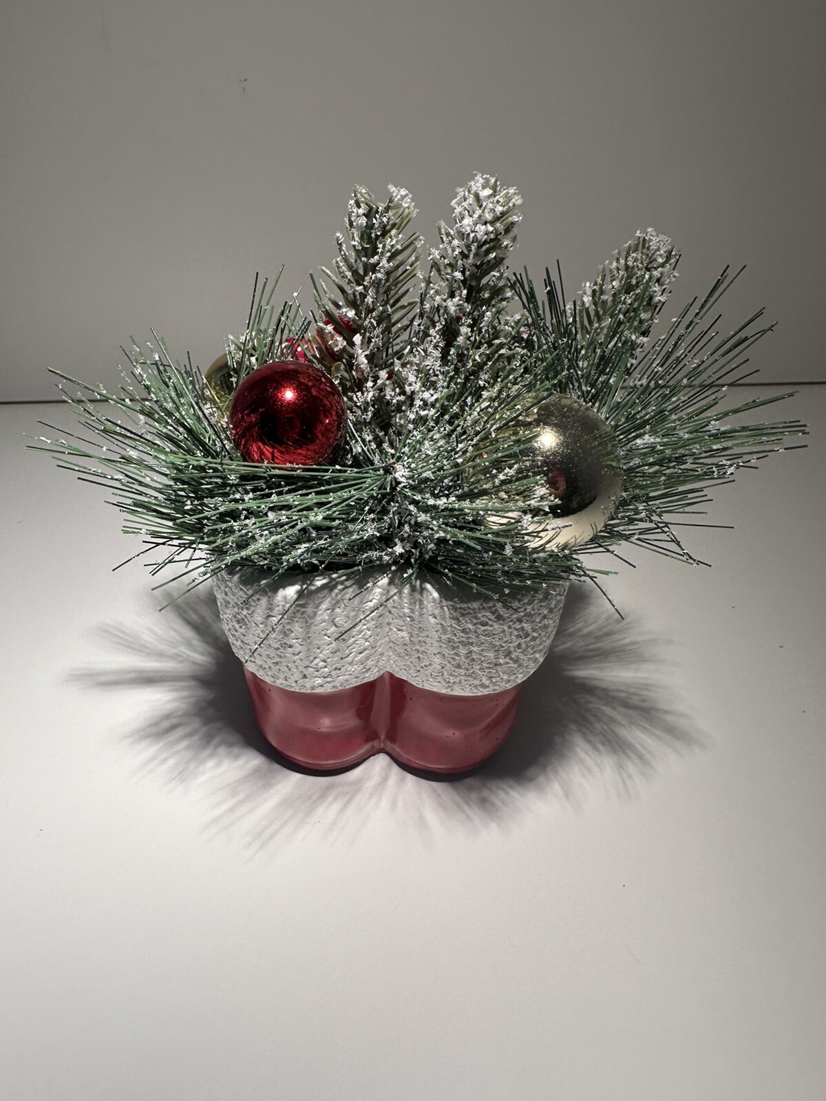 Vintage Concrete Pine Christmas Arrangement in A Pair Of Red Santa Clause Boots