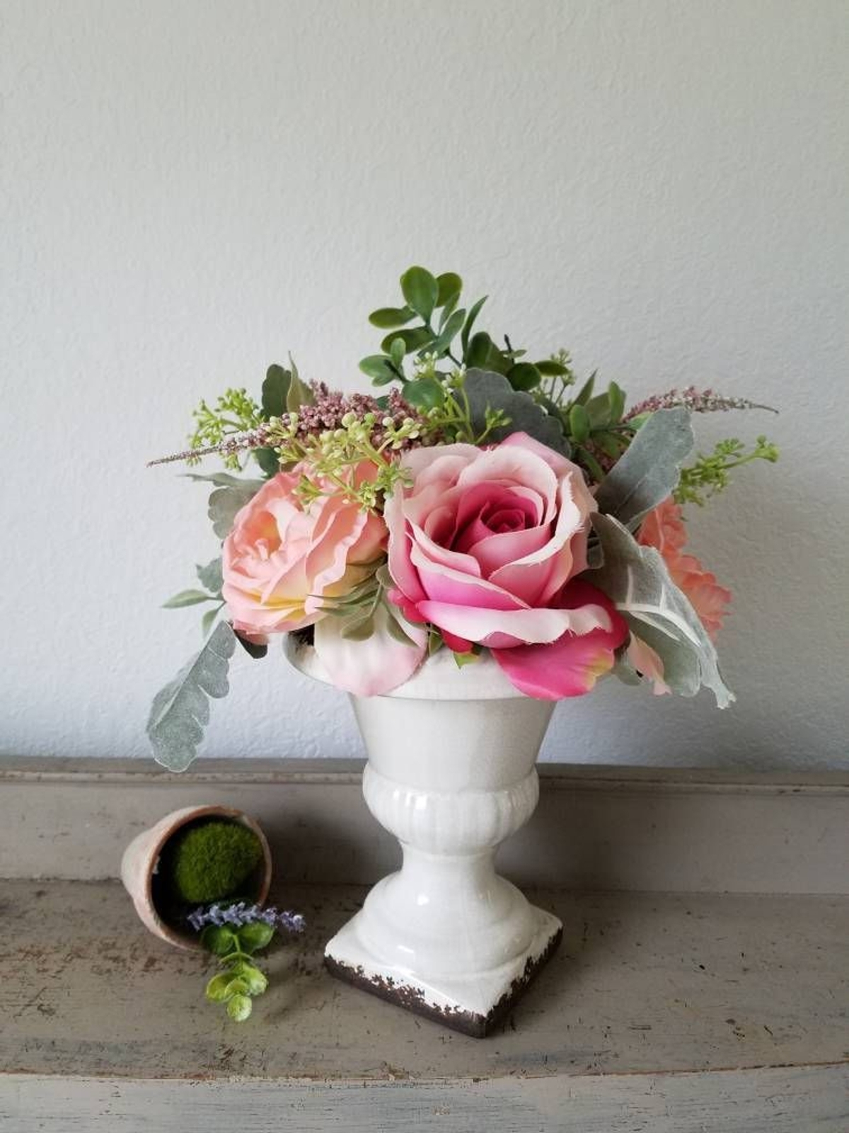 White Urn with faux flowers floral arrangement plants