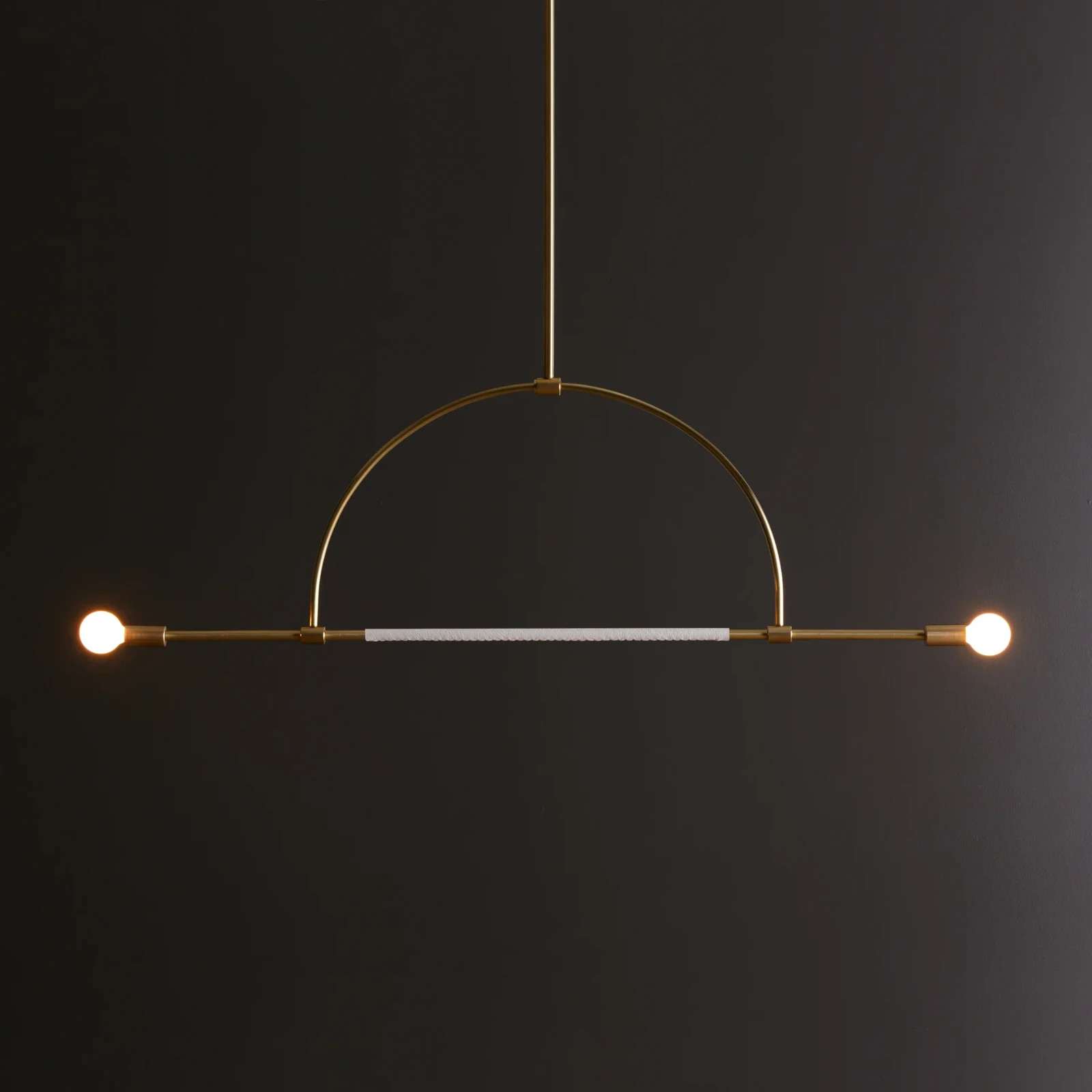 The Ellis Light is made from solid brass, with an optional leather wrap that is