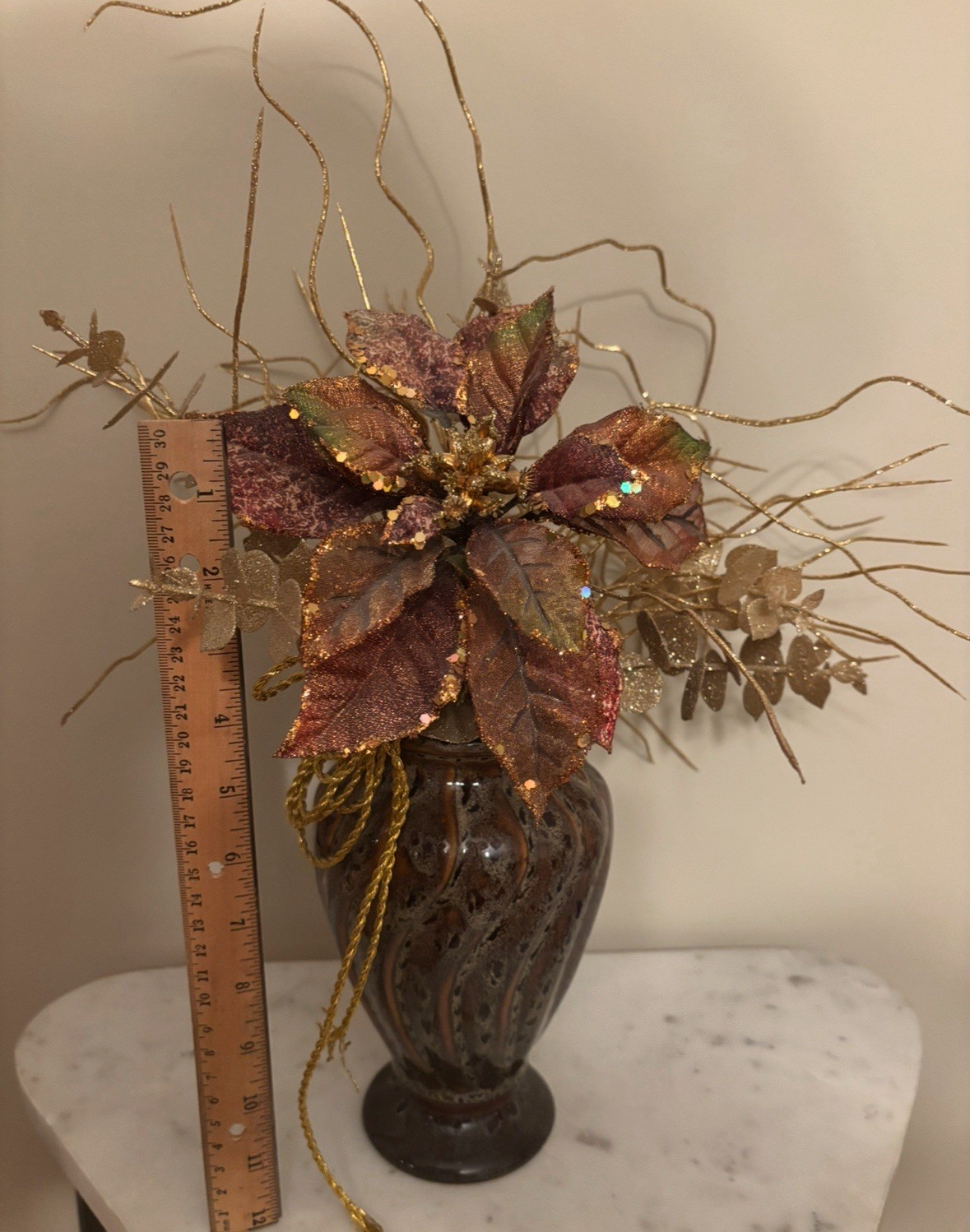 Beautiful golden centerpiece, matches all decor with glazed vase.