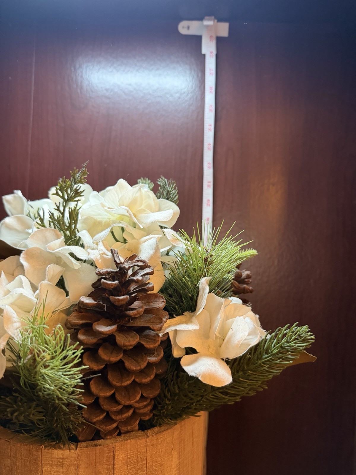 Artificial Pine Plant With White Flowers And Pinecones In Stand