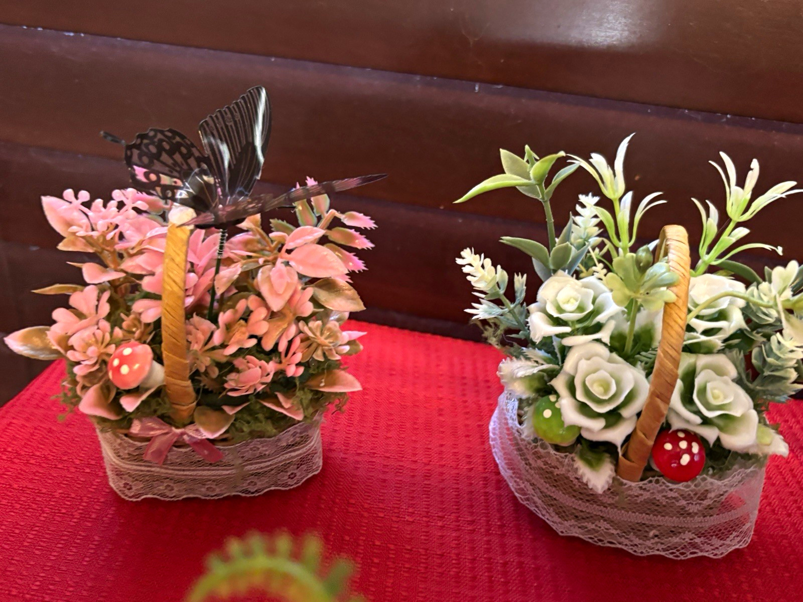 Artificial Floral Arrangement in White Wicker Baskets, Butterfly Accent