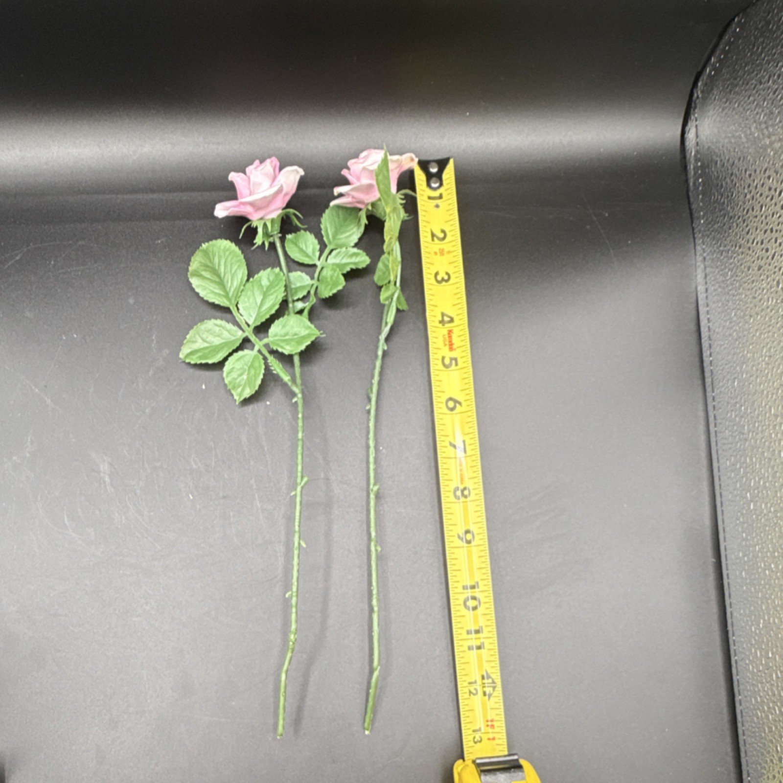 Porcelain flowers, pink roses with plastic stems and leaves