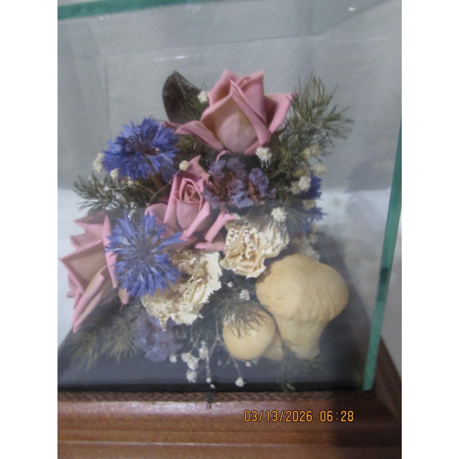 Vintage dried flower arrangement in glass with wood base butterfly mushrooms