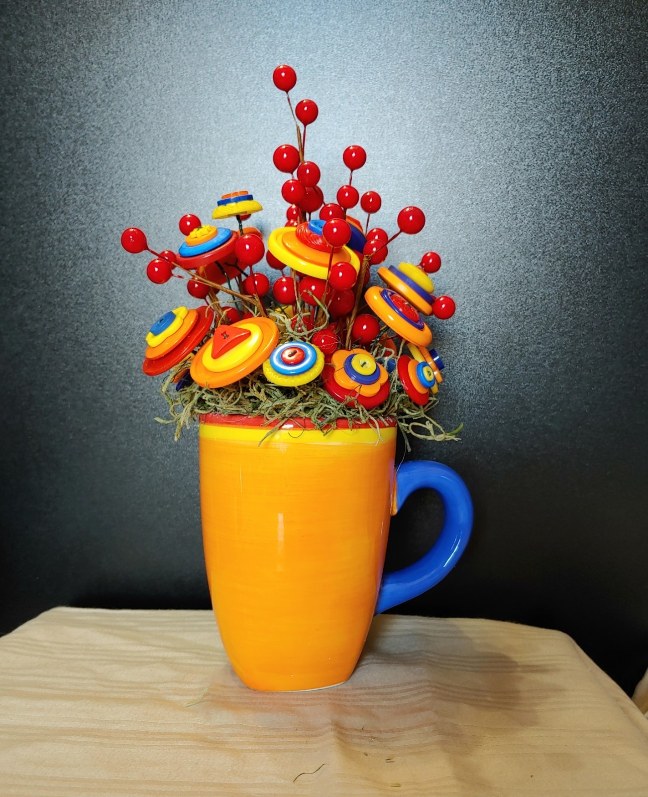 Bright Button Bouquet in Orange Coffee Mug. Red, orange, yellow. fun and playful