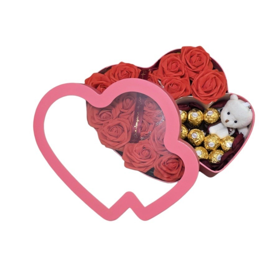 Eternal red flowers with a box in the shape of a pink heart, chocolate/bear.