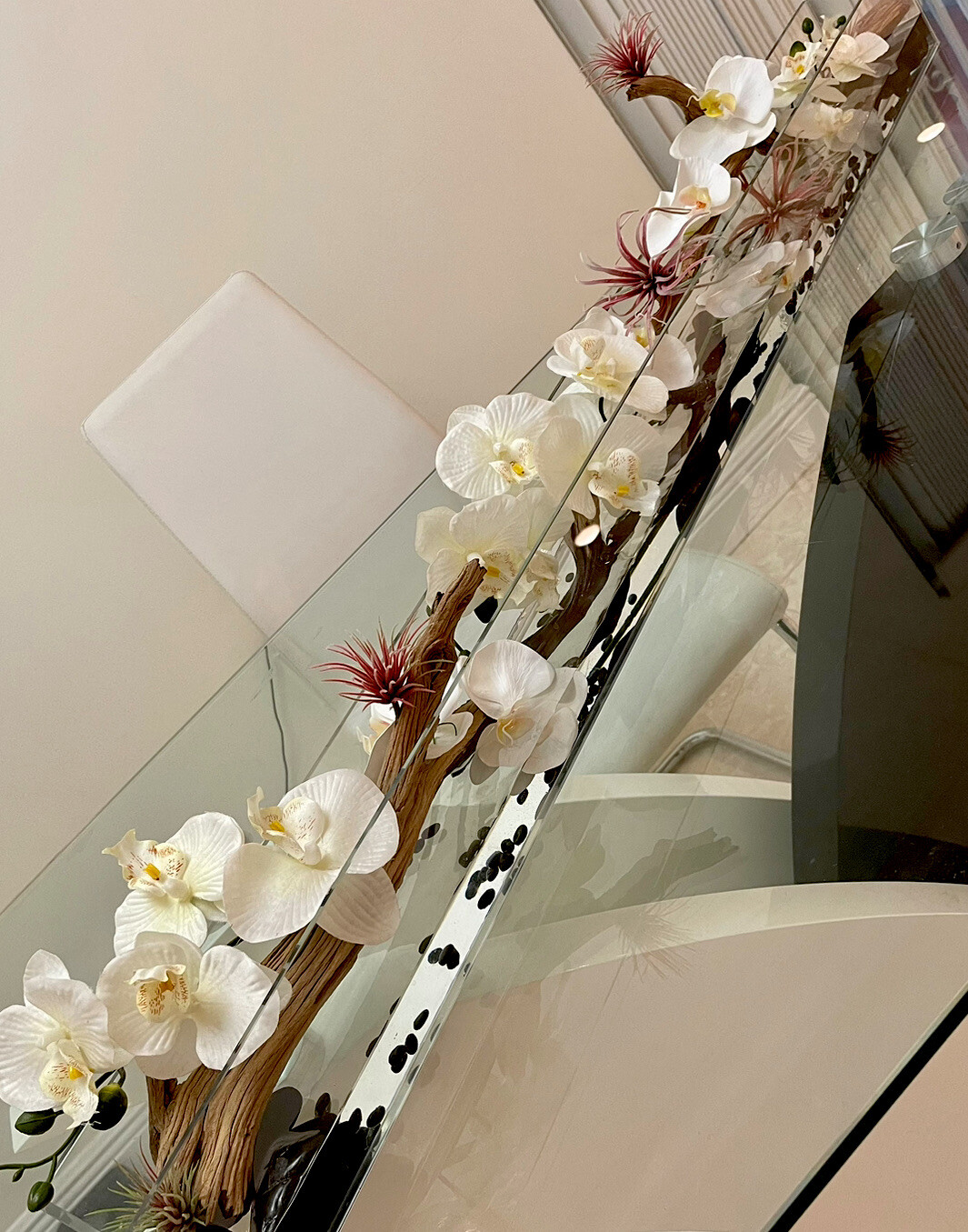 Silk orchid floral arrangement in rectangular glass vaseorchids arrangements48”