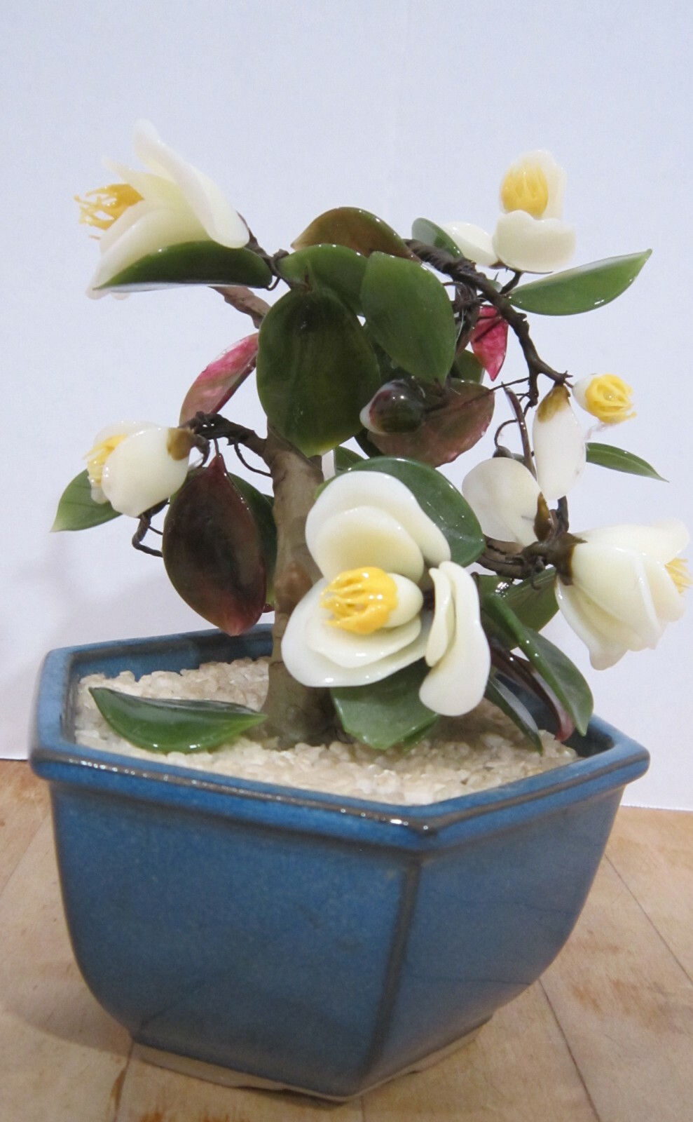 Vintage Japan glass flowers in blue bowl – 7-1/2″ high – yellows & greens VGC