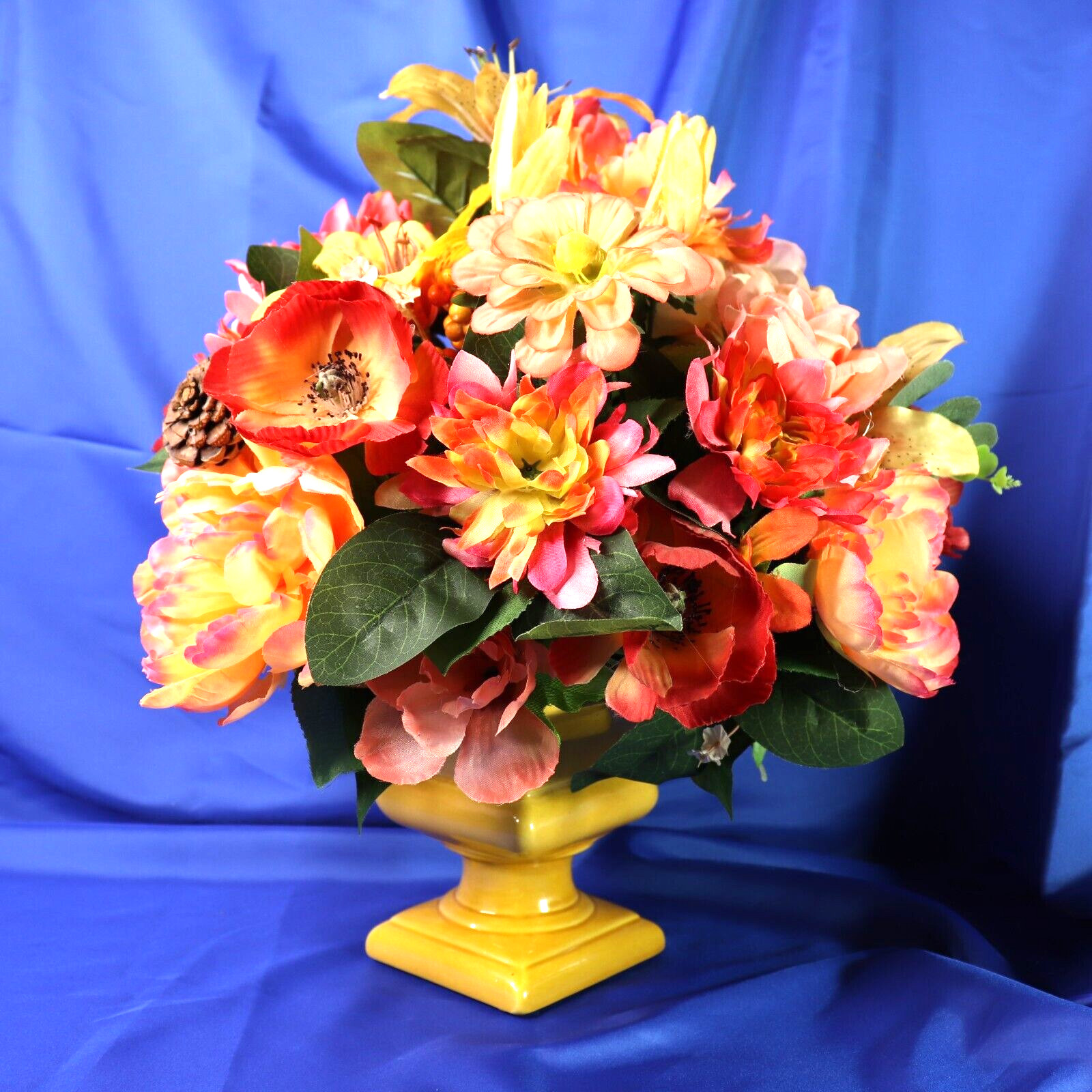 Lovely Floral Arrangement In Shades of Coral Pink & Yellow in a Square Planter