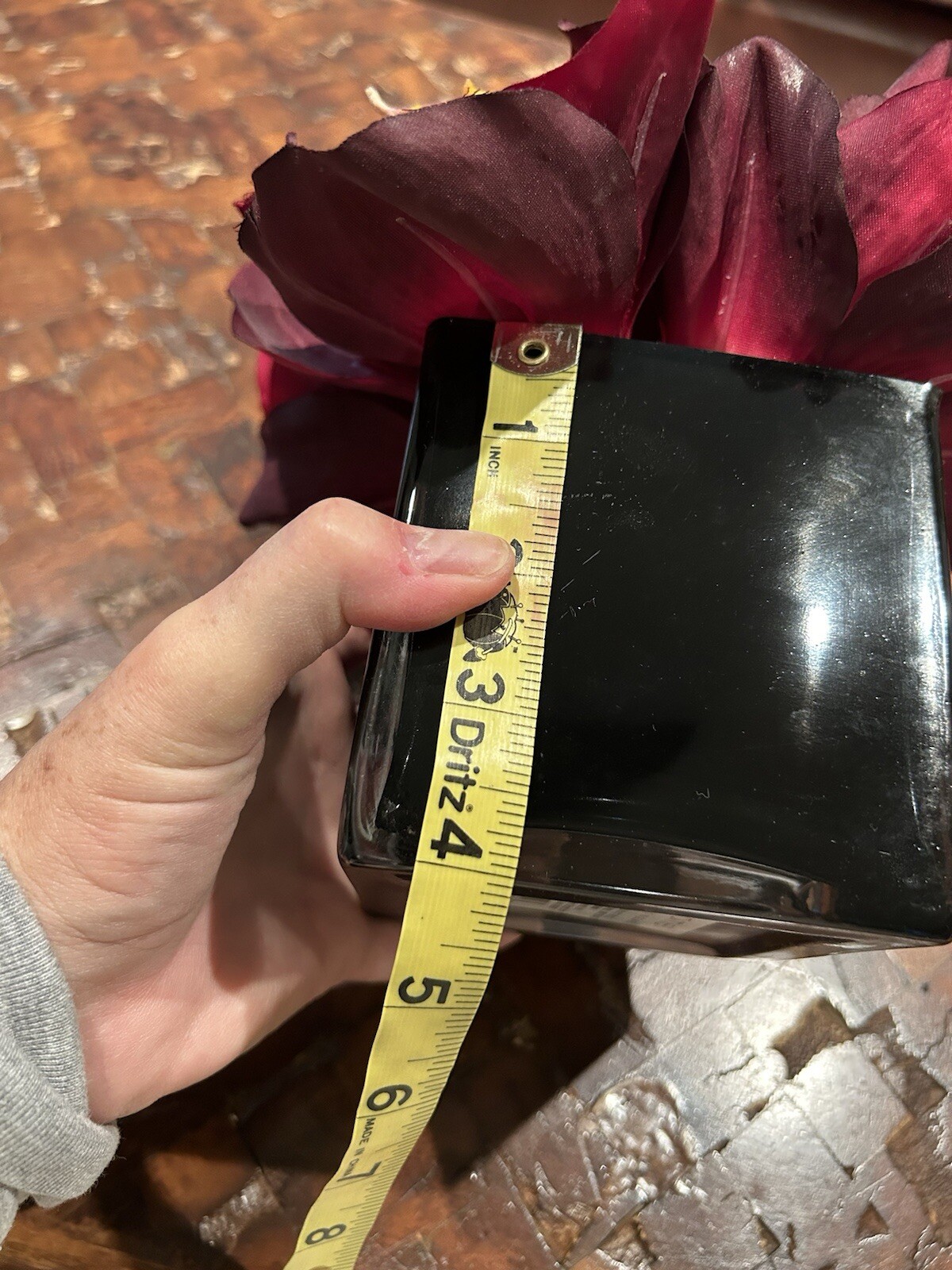 Artificial Amaryllis in Black Glass Vase