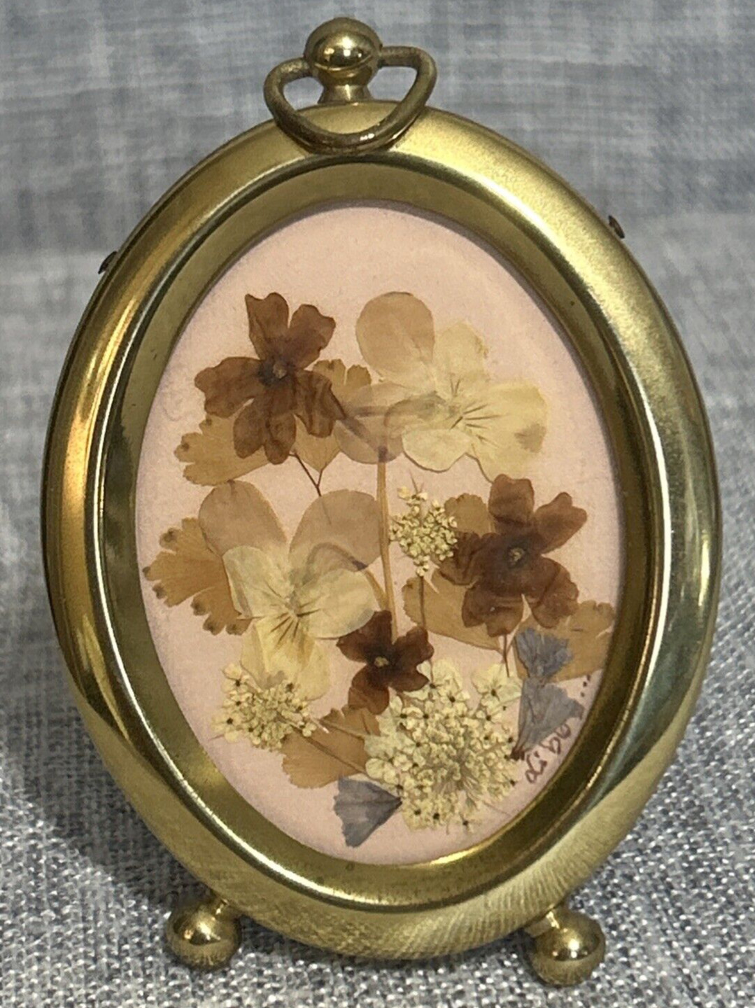 Beautiful Vintage Pressed Florals in a 4″ Tall Gold Tone Oval Frame