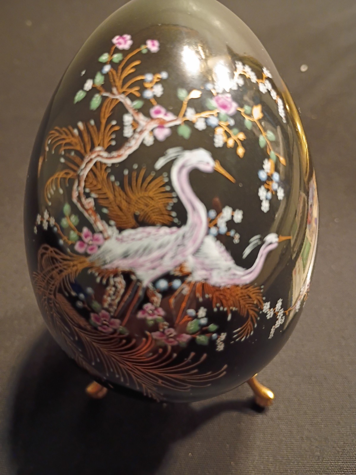 Designer Egg Depicting Swans With A Beautiful Flower Arrangement