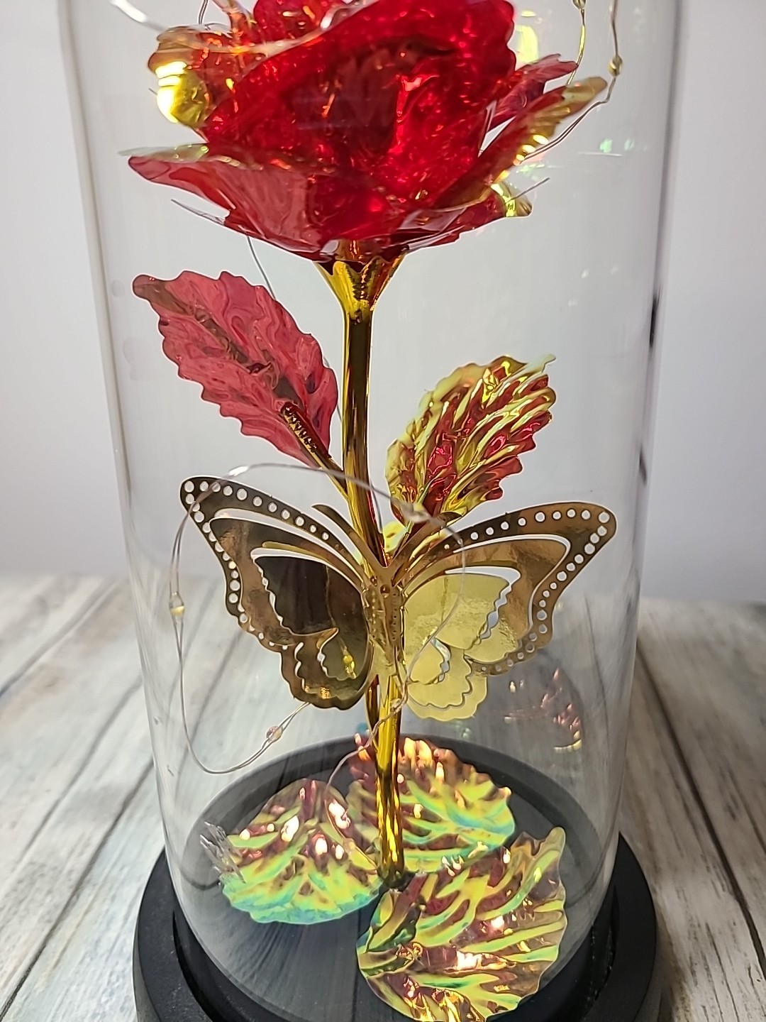 Light Up Rose In Glass With Butterfly And Rose Petals On The Bottom. Red/ Gold.