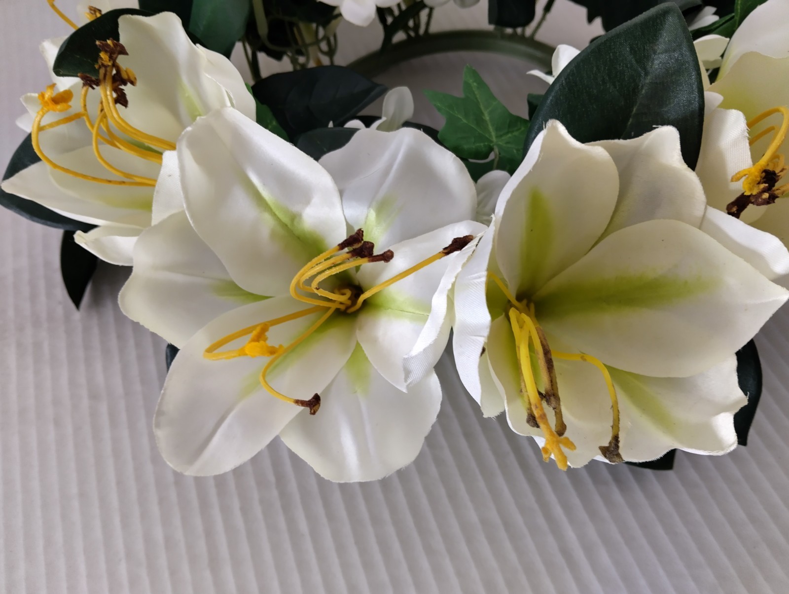 Amaryllis candle ring for a 6″ pillar candle or cremation urn.