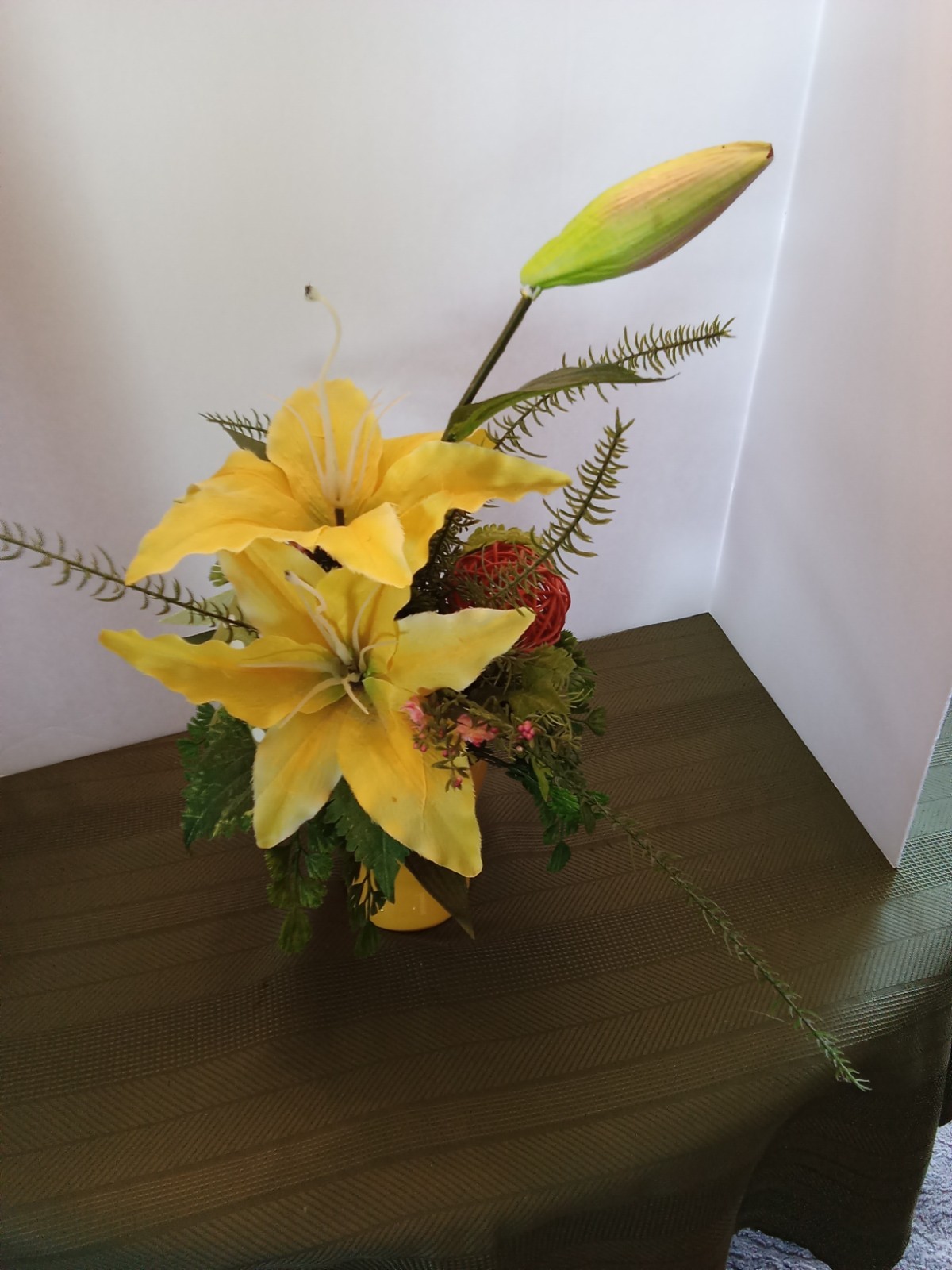 vase with artificial flowers yellow