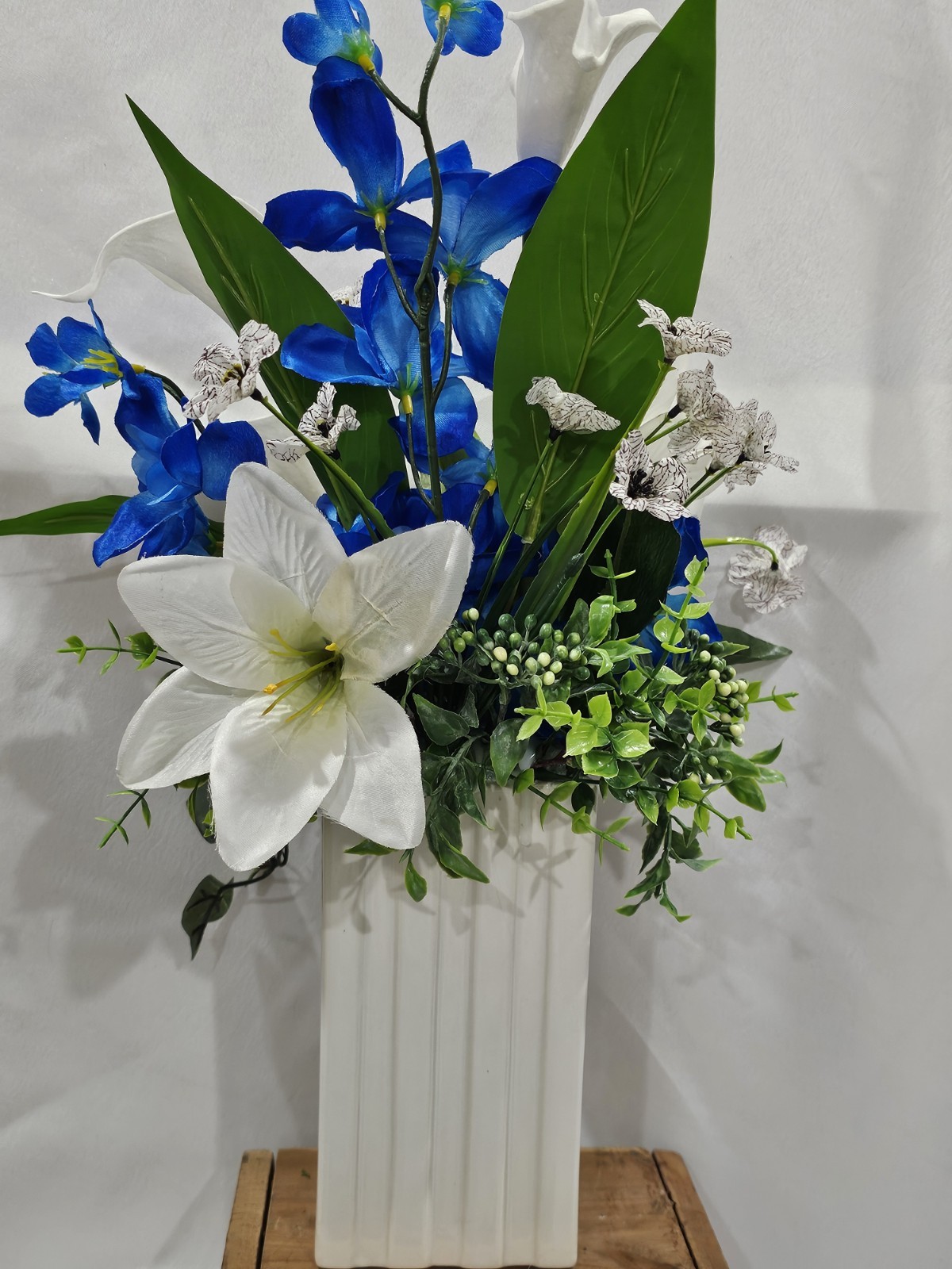 Blue with White Lilies Flower Arrangement Lush green & white ceramic vase
