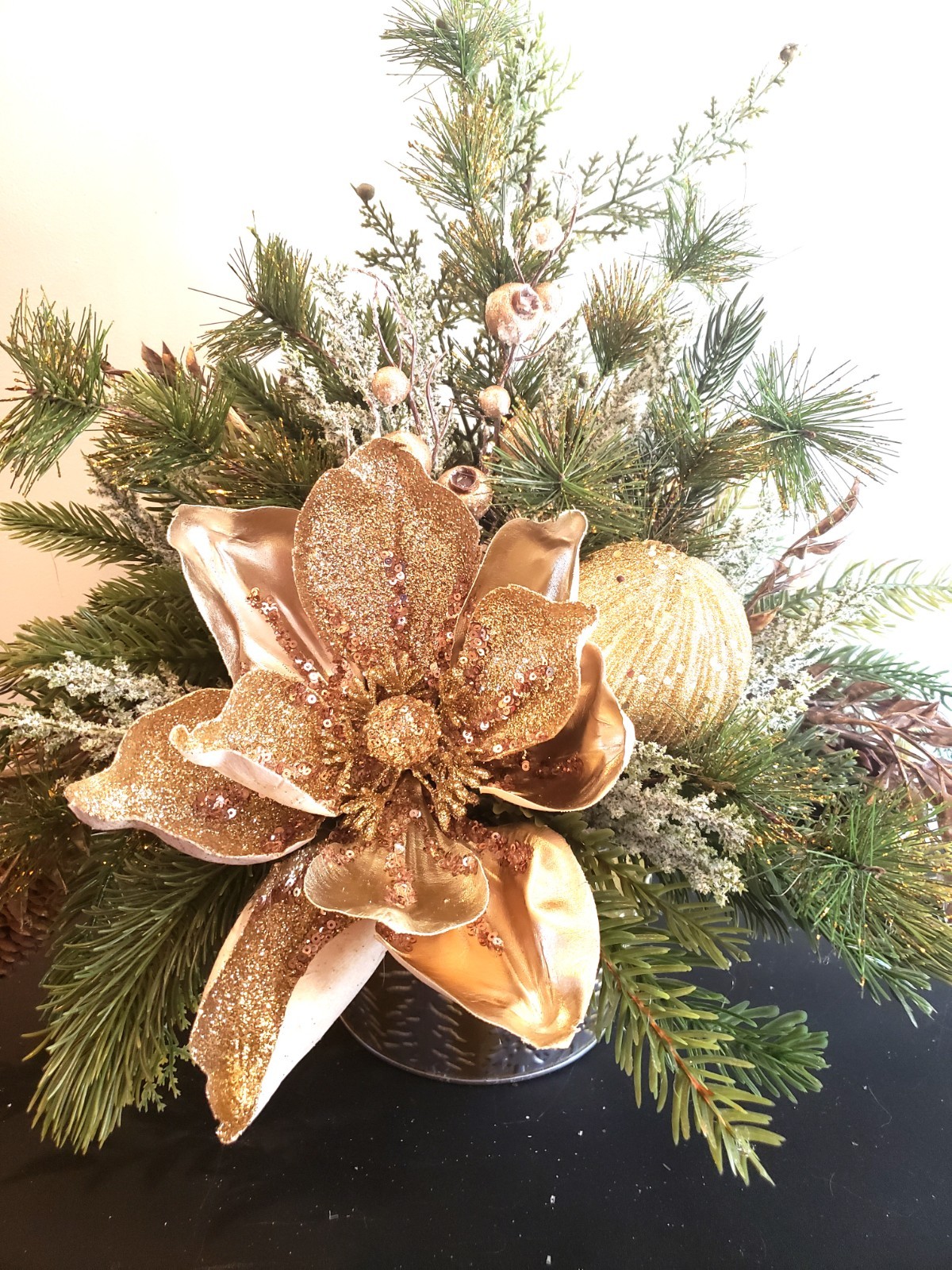 Gold magnolia Christmas floral arrangement, holiday floral arrangement
