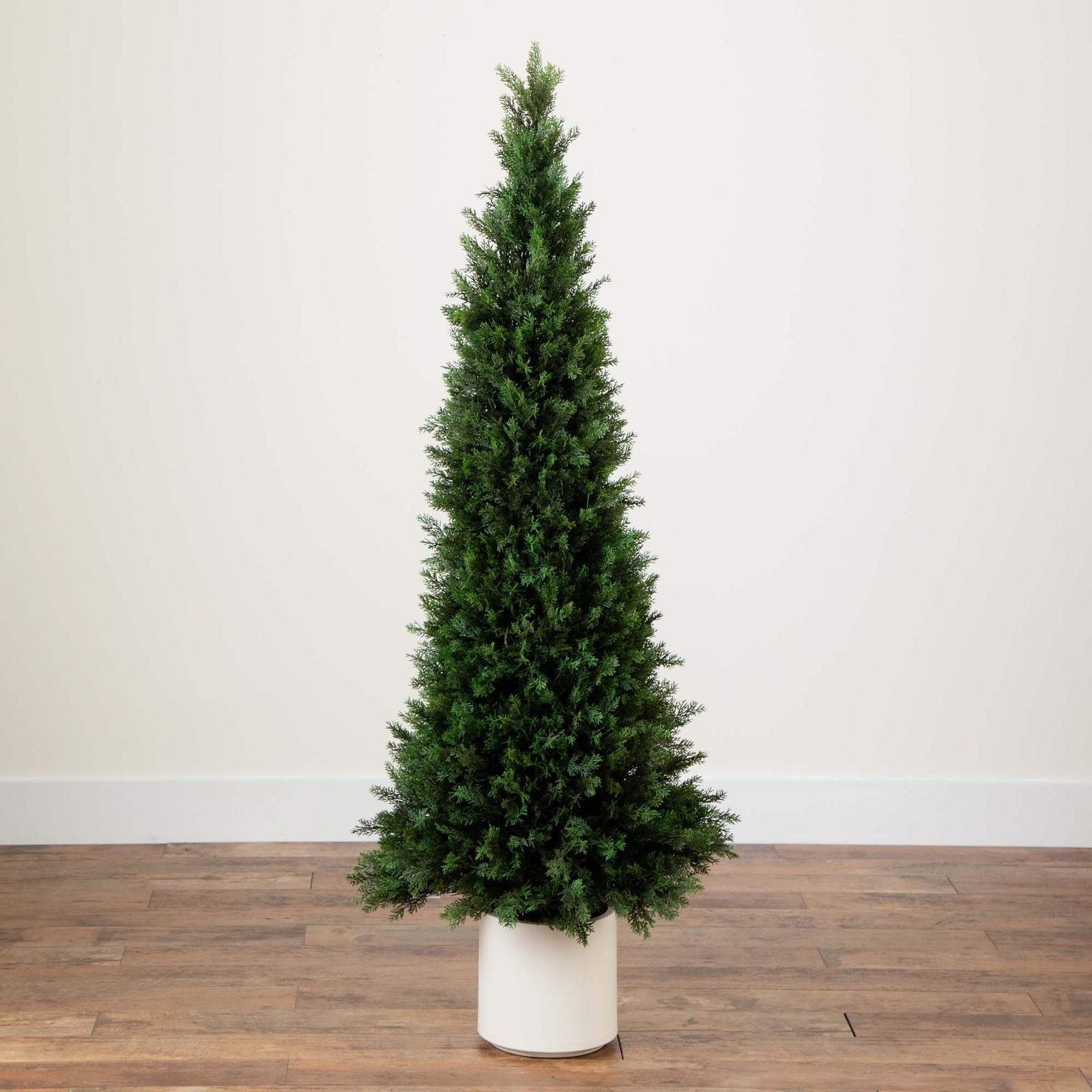 Nearly Natural 5ft UV Resistant Cedar Tree in White Planter in Green