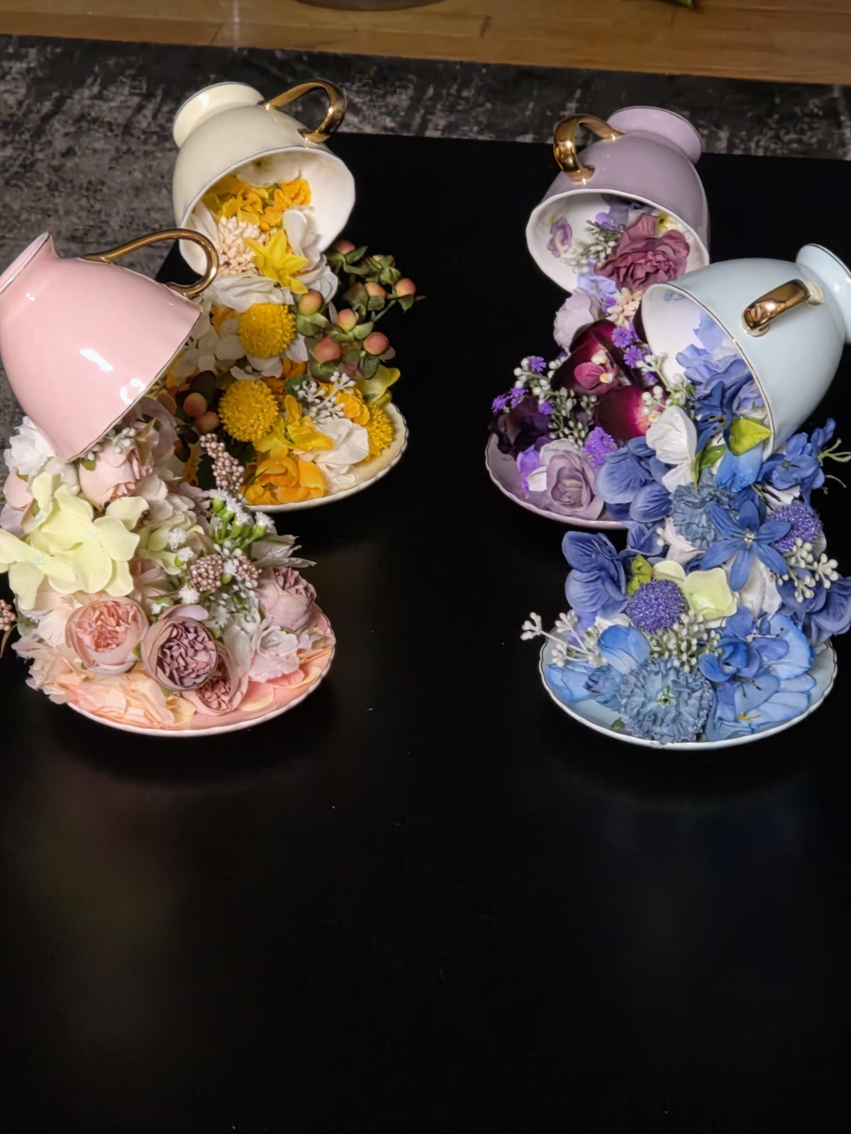 Floating Tea Cup Decorated With Faux Flowers Arrangement