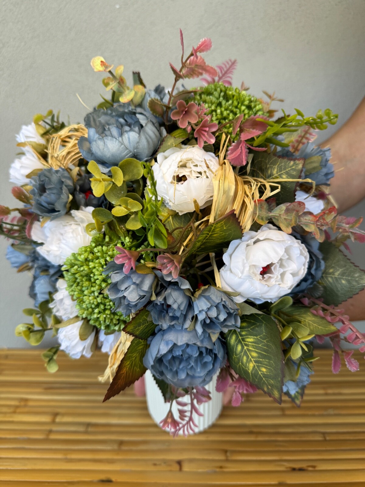 Blue and white flower arrangement in a vase , width 12’, height 15’, home decor.
