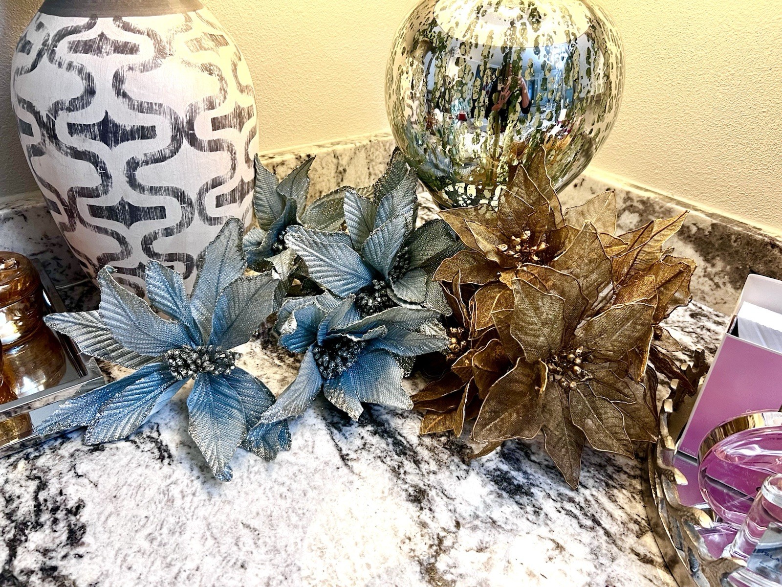 poinsettia flowers in a metallic Blue & silver used as decorations for Christmas