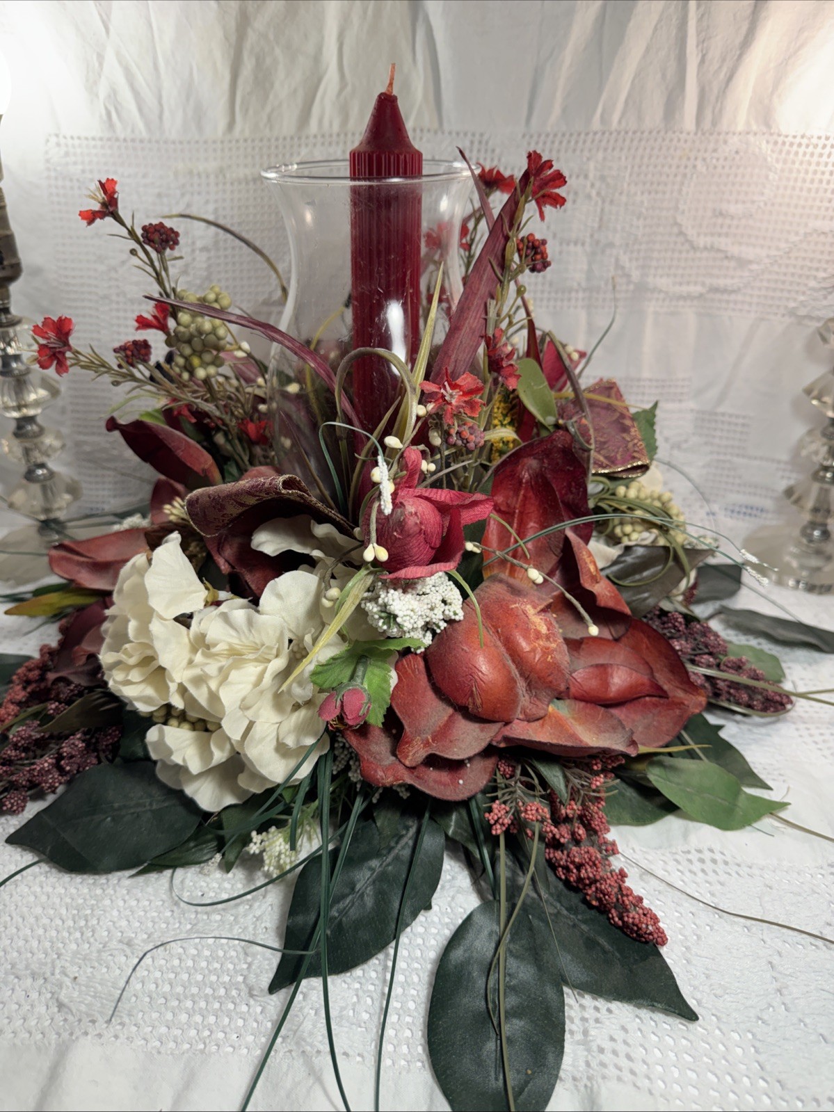 Artificial Fall Themed Floral Centerpiece Surrounding A Glass Vase