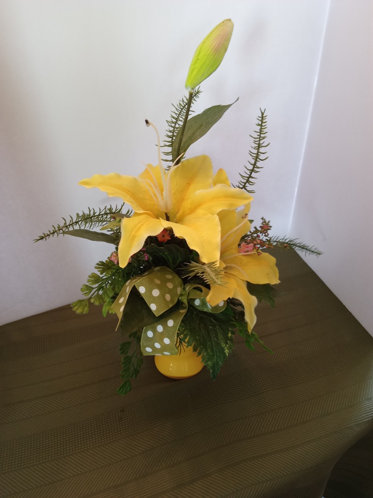 vase with artificial flowers yellow