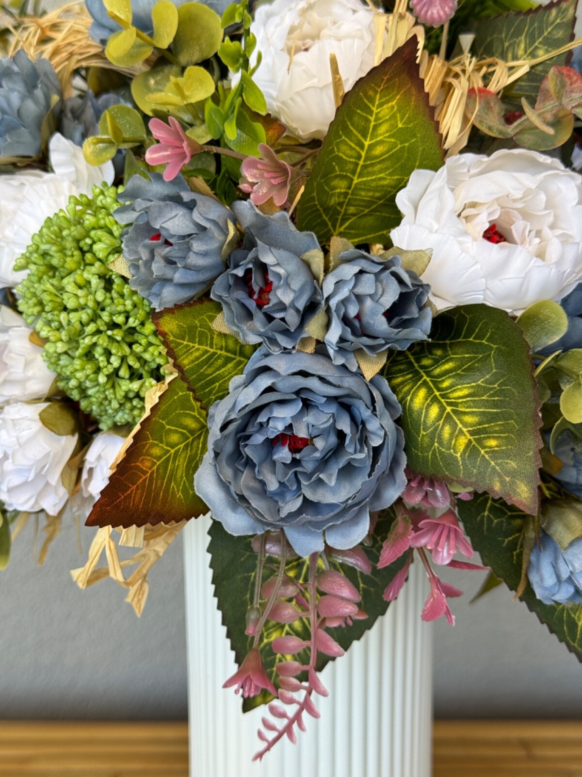 Blue and white flower arrangement in a vase , width 12’, height 15’, home decor.