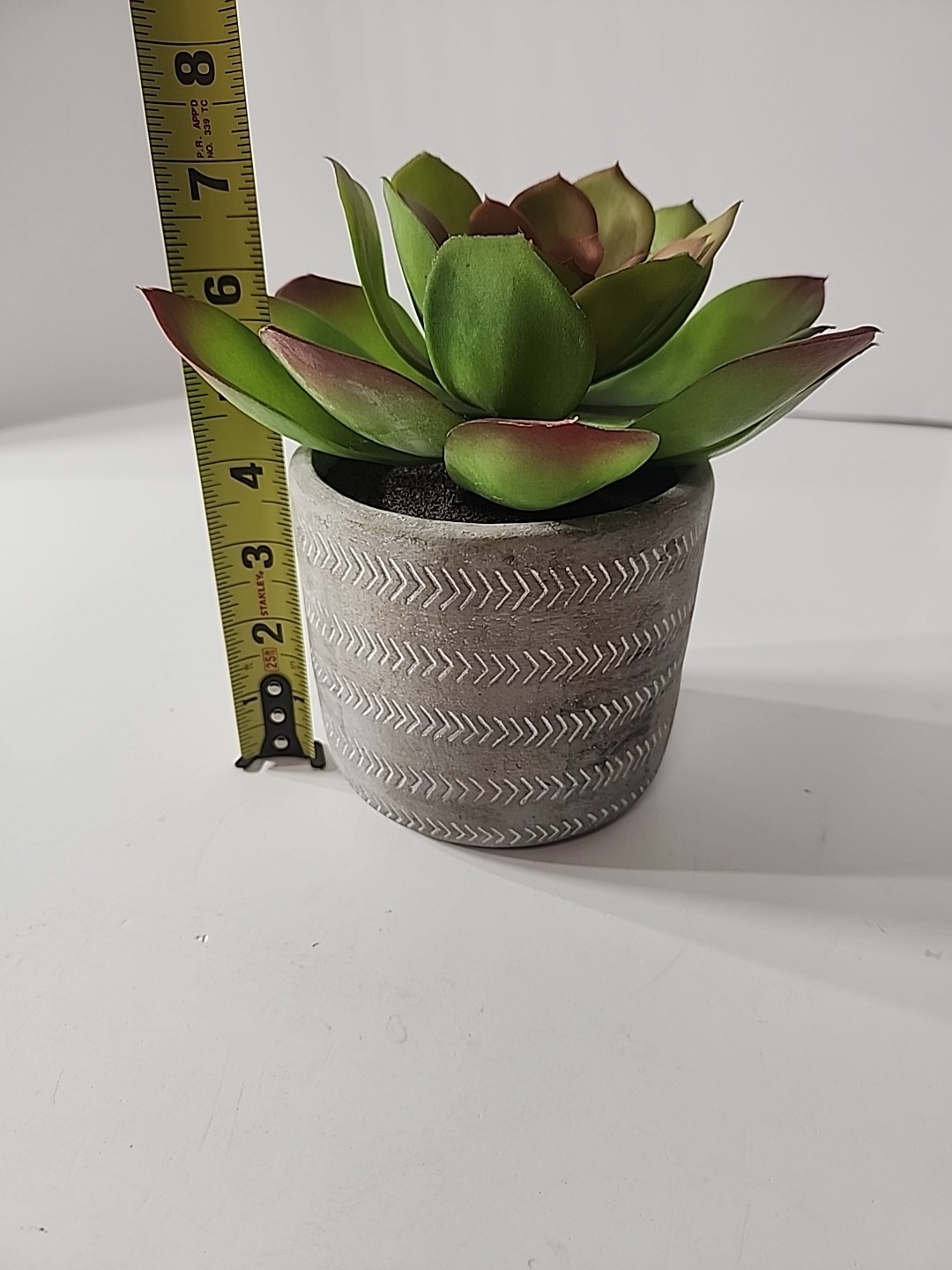 7.5 Inch Artificial House Plant In Decorative Stone Pot.