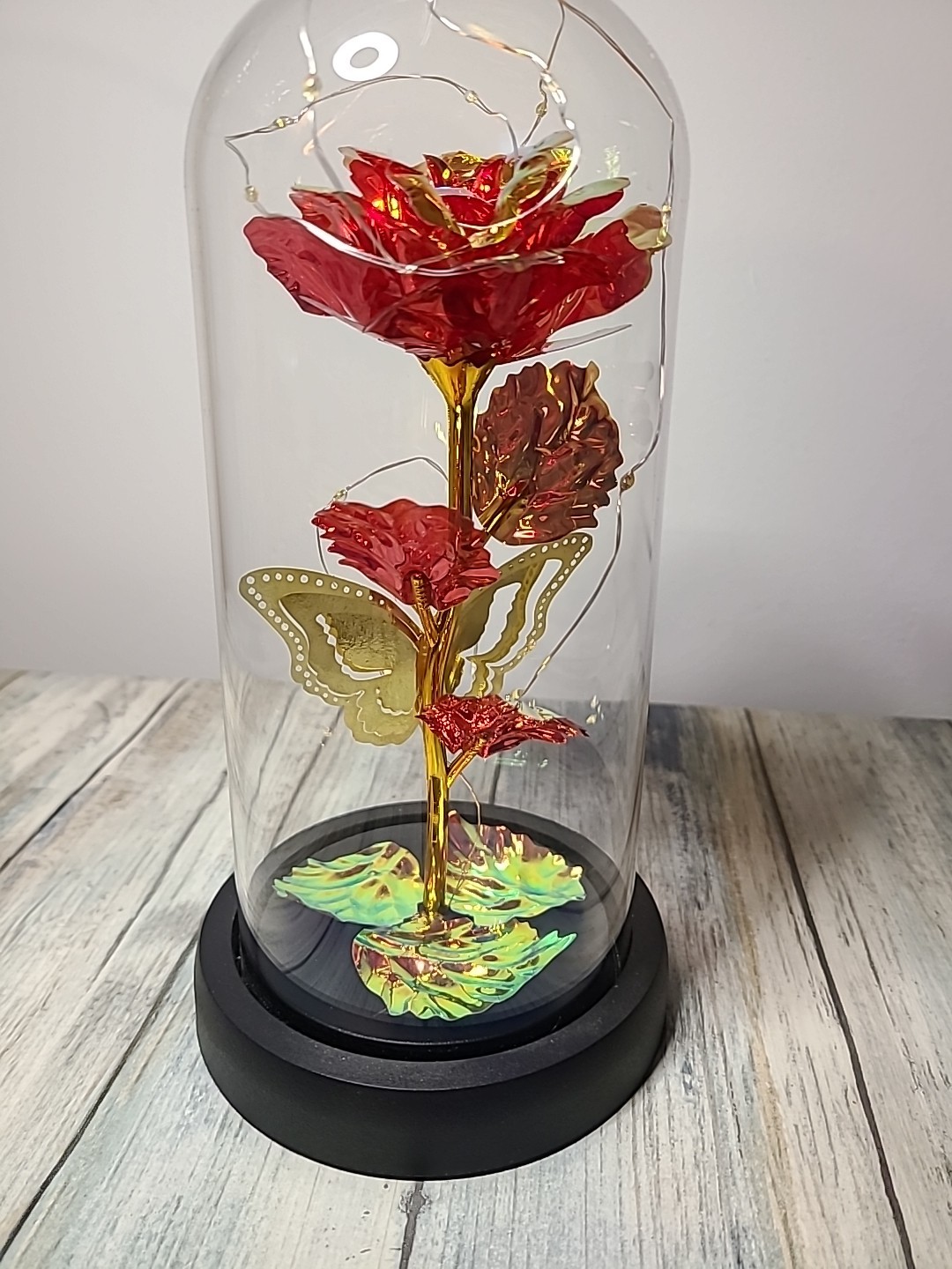 Light Up Rose In Glass With Butterfly And Rose Petals On The Bottom. Red/ Gold.