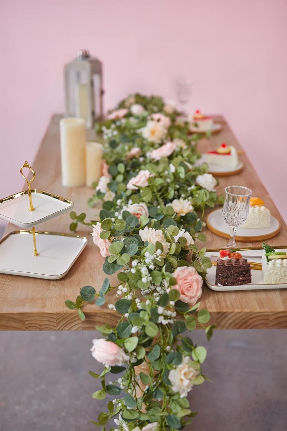 Artificial eucalyptus wreath with flowers, fake roses, and baby’s breath flowers