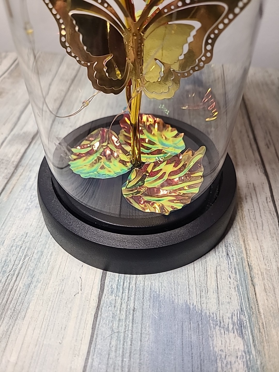 Light Up Rose In Glass With Butterfly And Rose Petals On The Bottom. Red/ Gold.