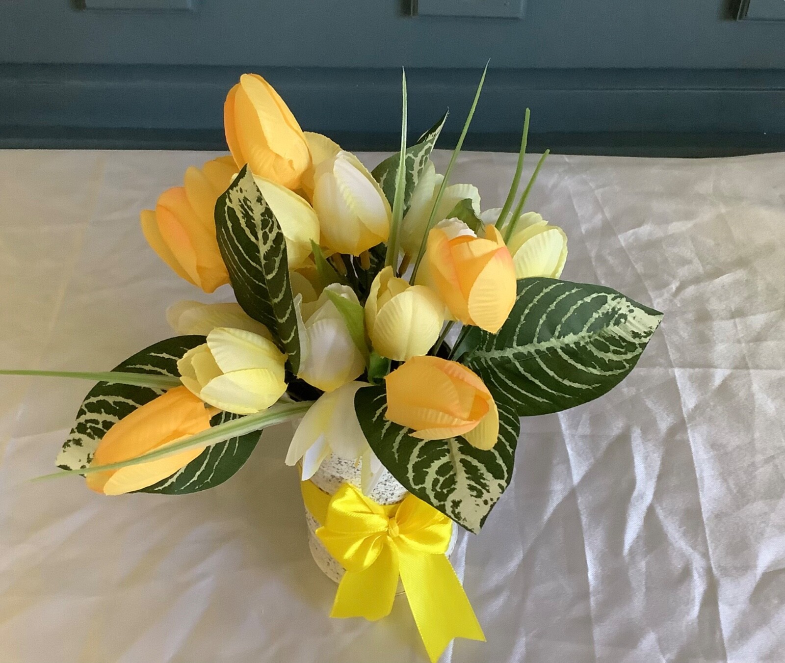 Spring/easter yellow tulip centerpiece with glitter and painted upcycled tin can