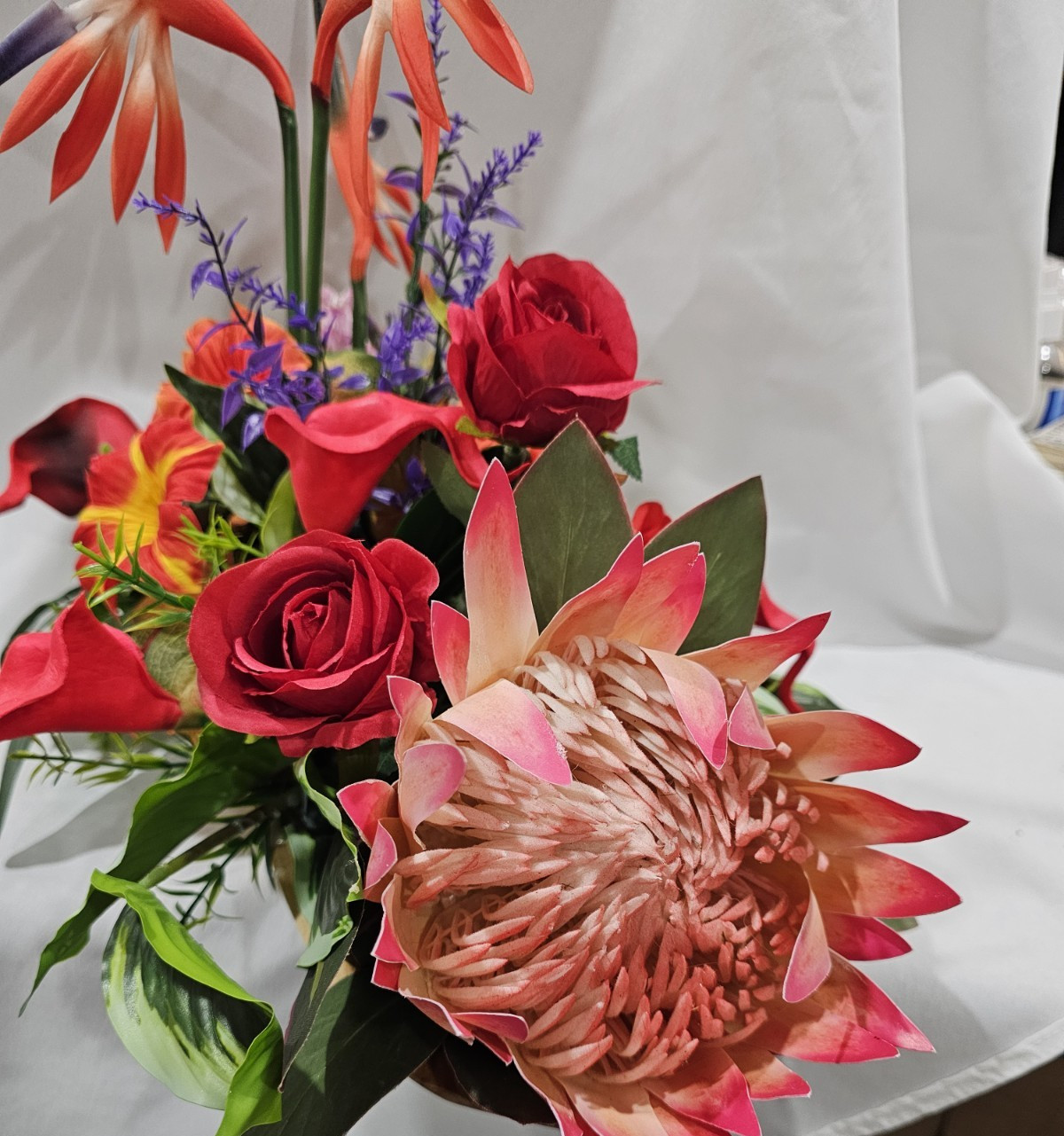 Bright Colors in this Artificial Tropical arrangement, Birds of Paradise etc.