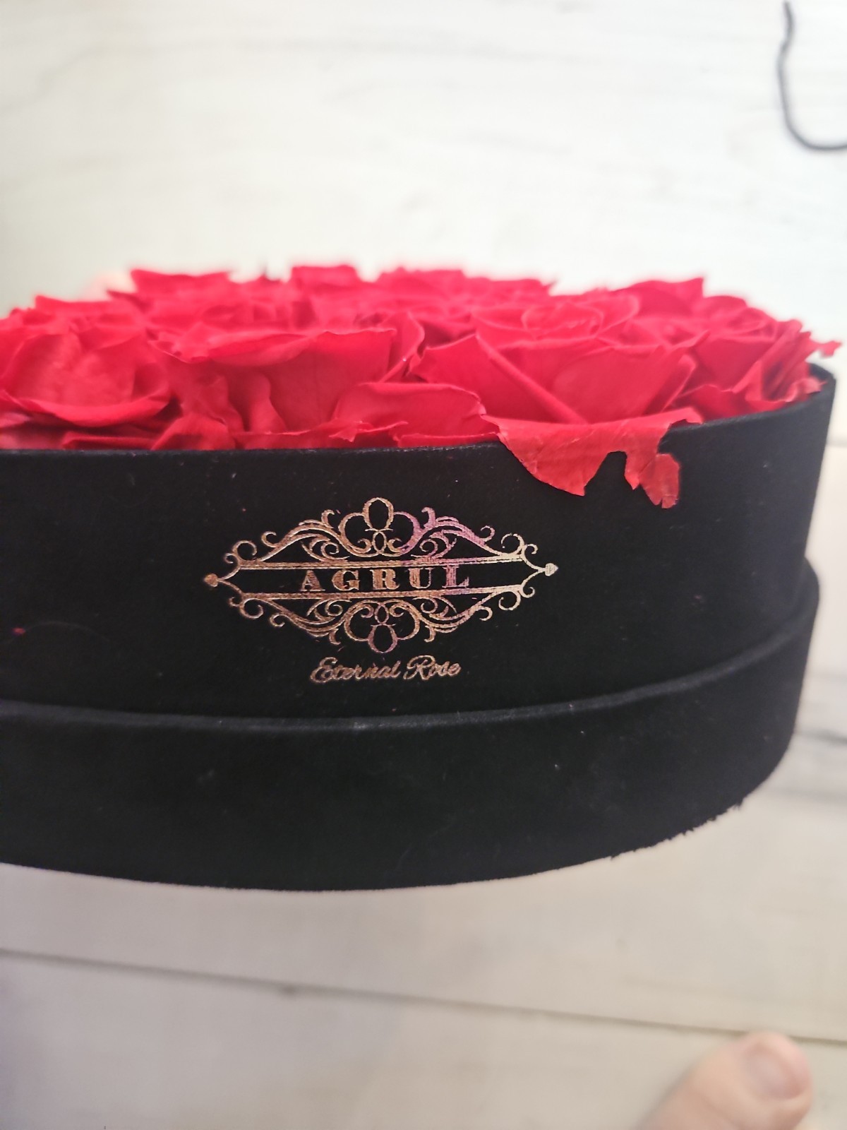 Eternal Rose heart-shaped arrangement containing 16 preserved red roses