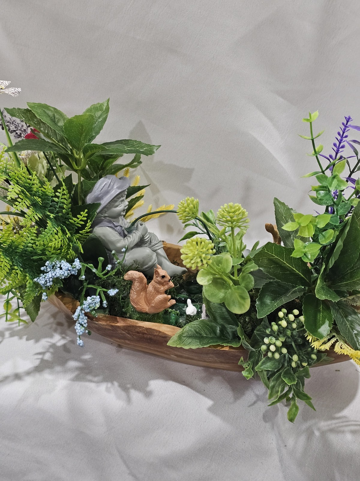 Artifical Flower Arramgement in woods, Boy Fishing Deer, Turtle Duck