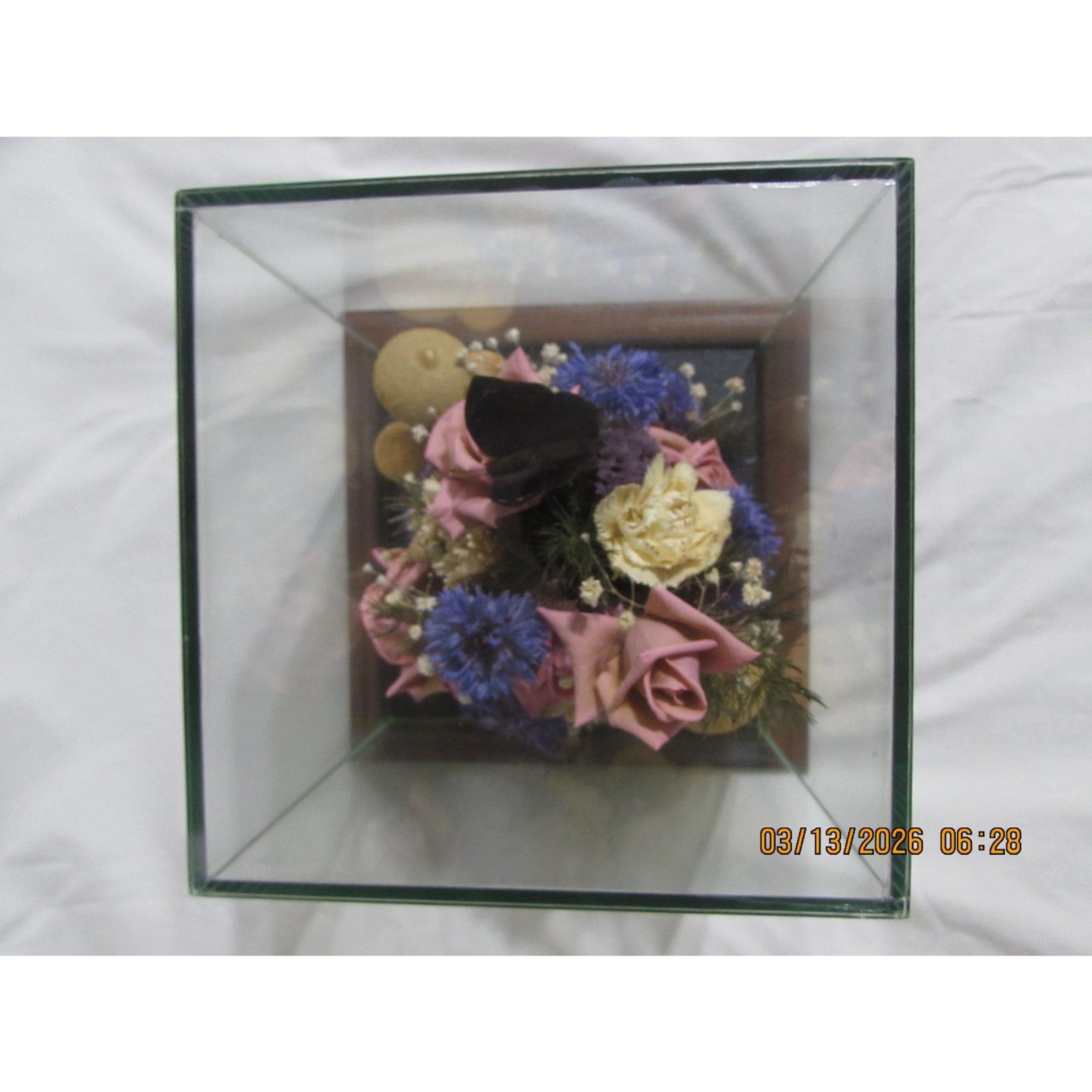 Vintage dried flower arrangement in glass with wood base butterfly mushrooms