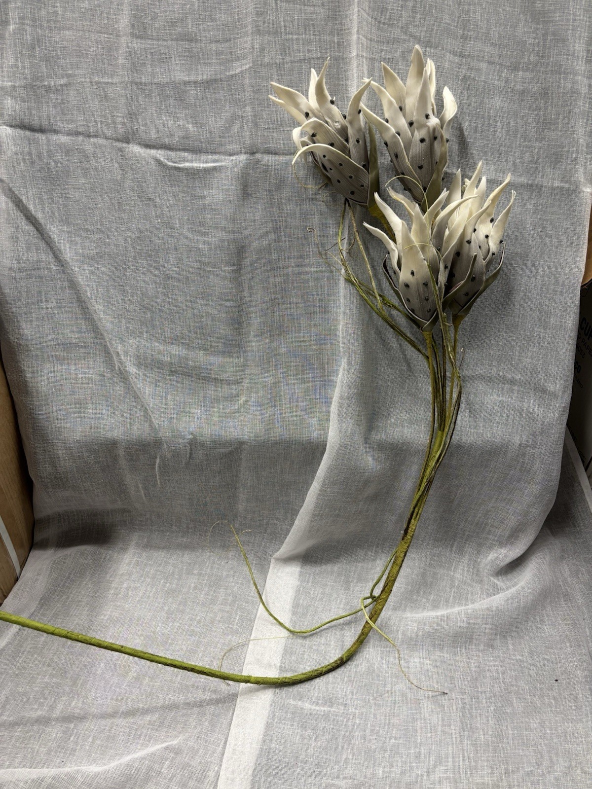 Artificial Flowers Off White and Black Spots with Green Leaves