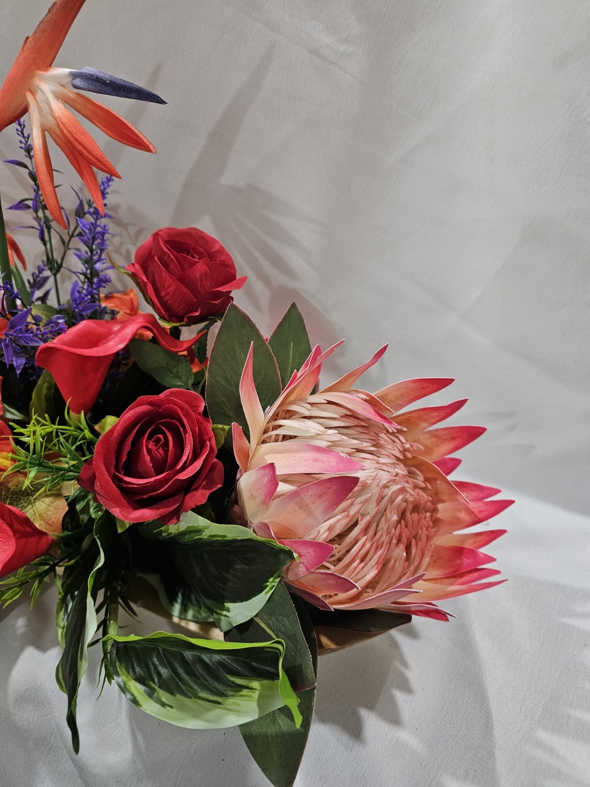 Bright Colors in this Artificial Tropical arrangement, Birds of Paradise etc.