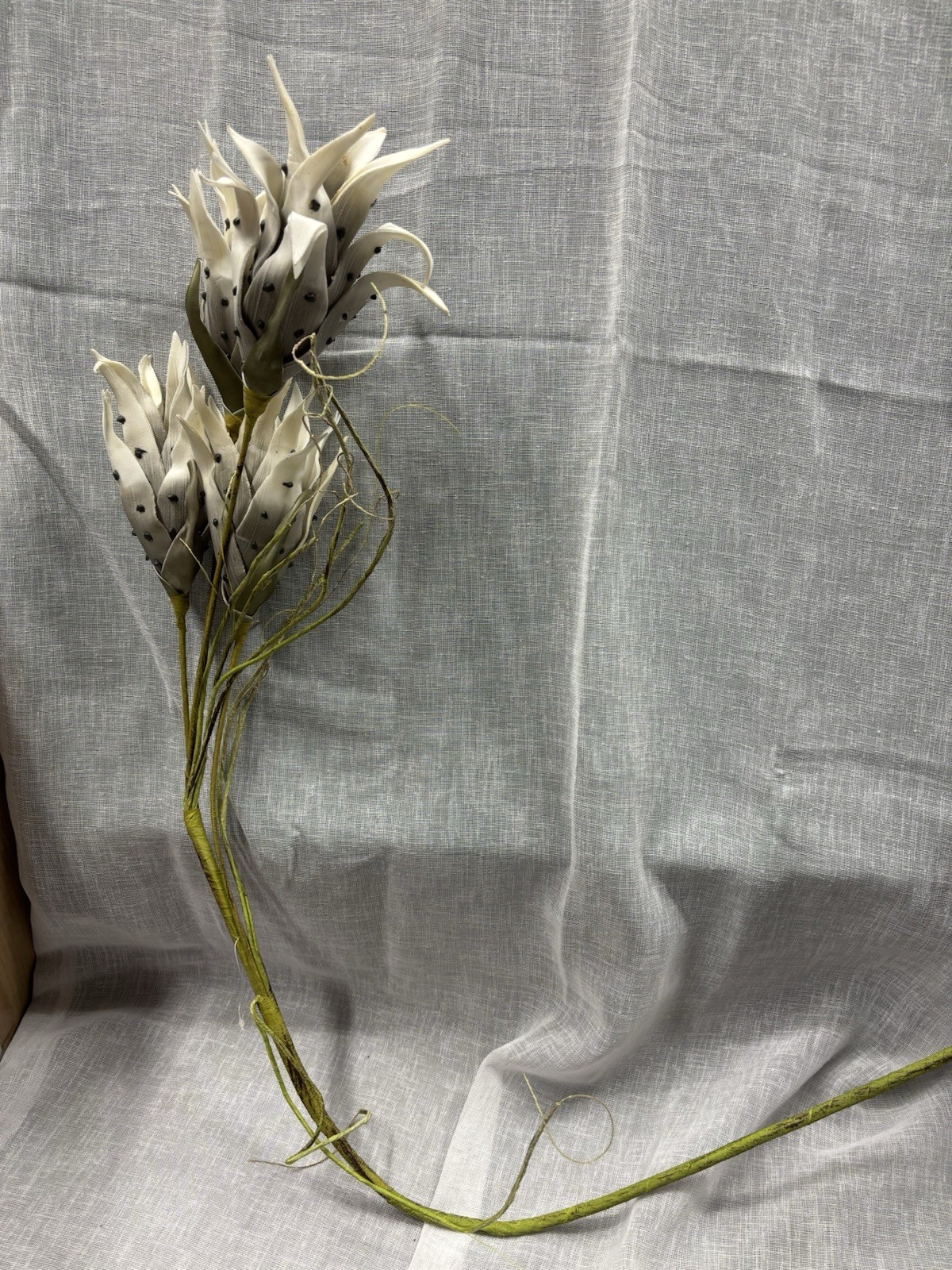 Artificial Flowers Off White and Black Spots with Green Leaves