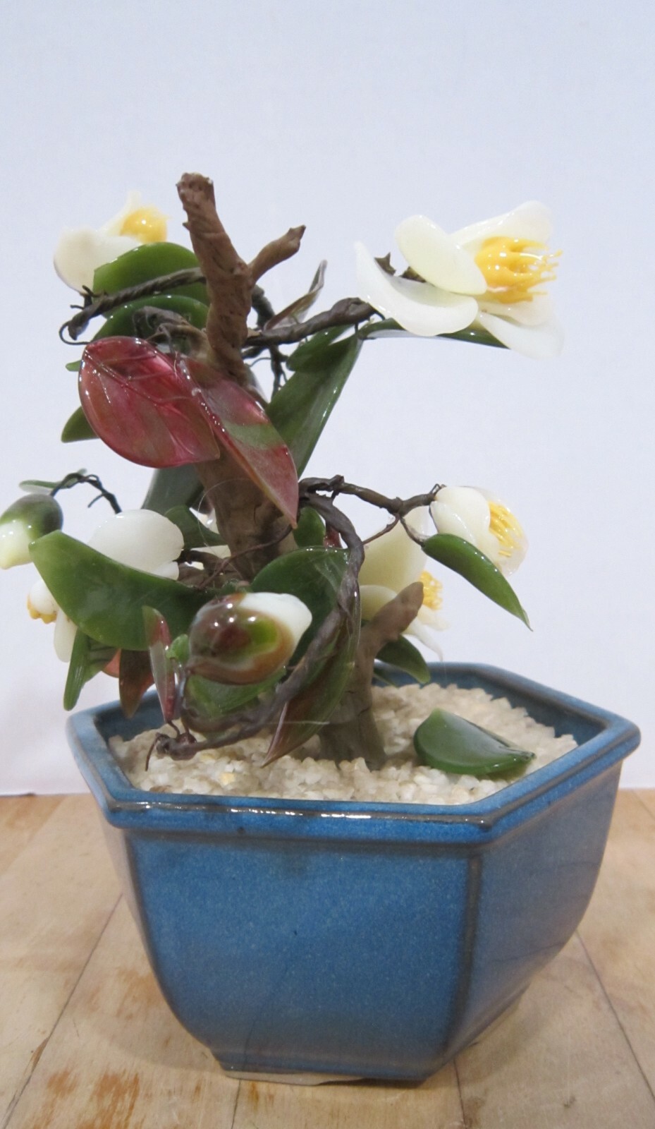 Vintage Japan glass flowers in blue bowl – 7-1/2″ high – yellows & greens VGC