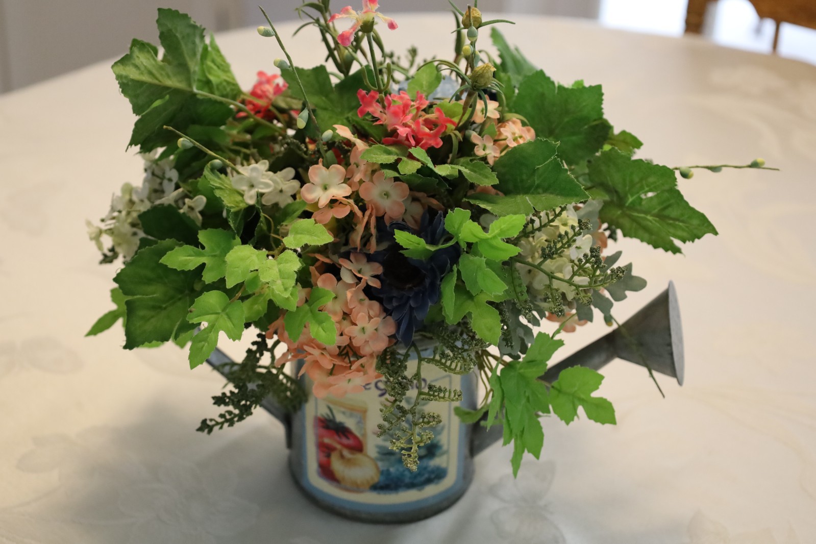Spring Multicolor Artificial Floral in a Watering Can Table Decoration