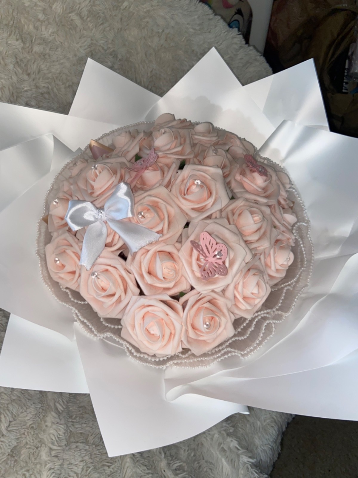 Pink flower bouquet made with 25 artificial flowers.