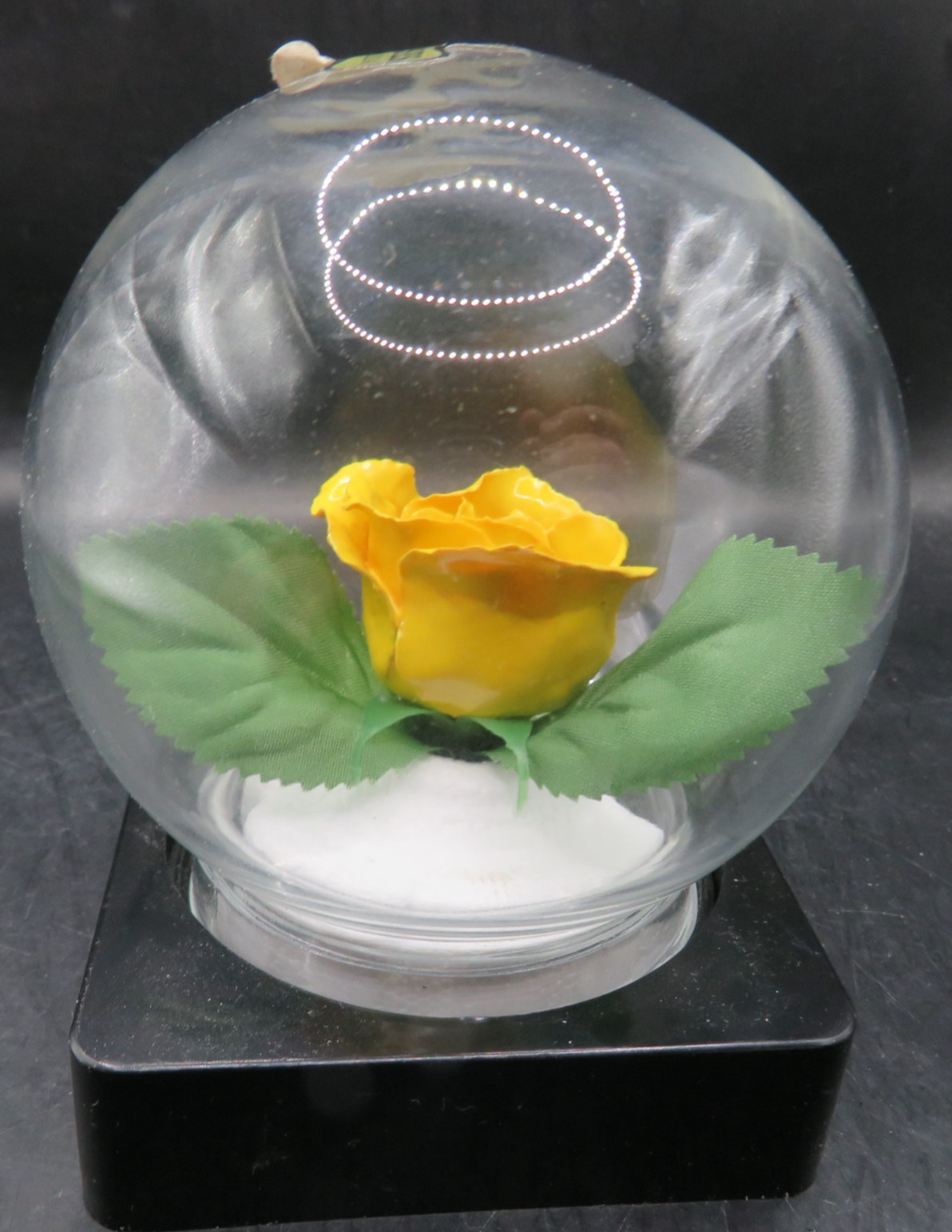 Lifesake Flowers REAL ROSES Yellow Rose In a clear globe on a back base.