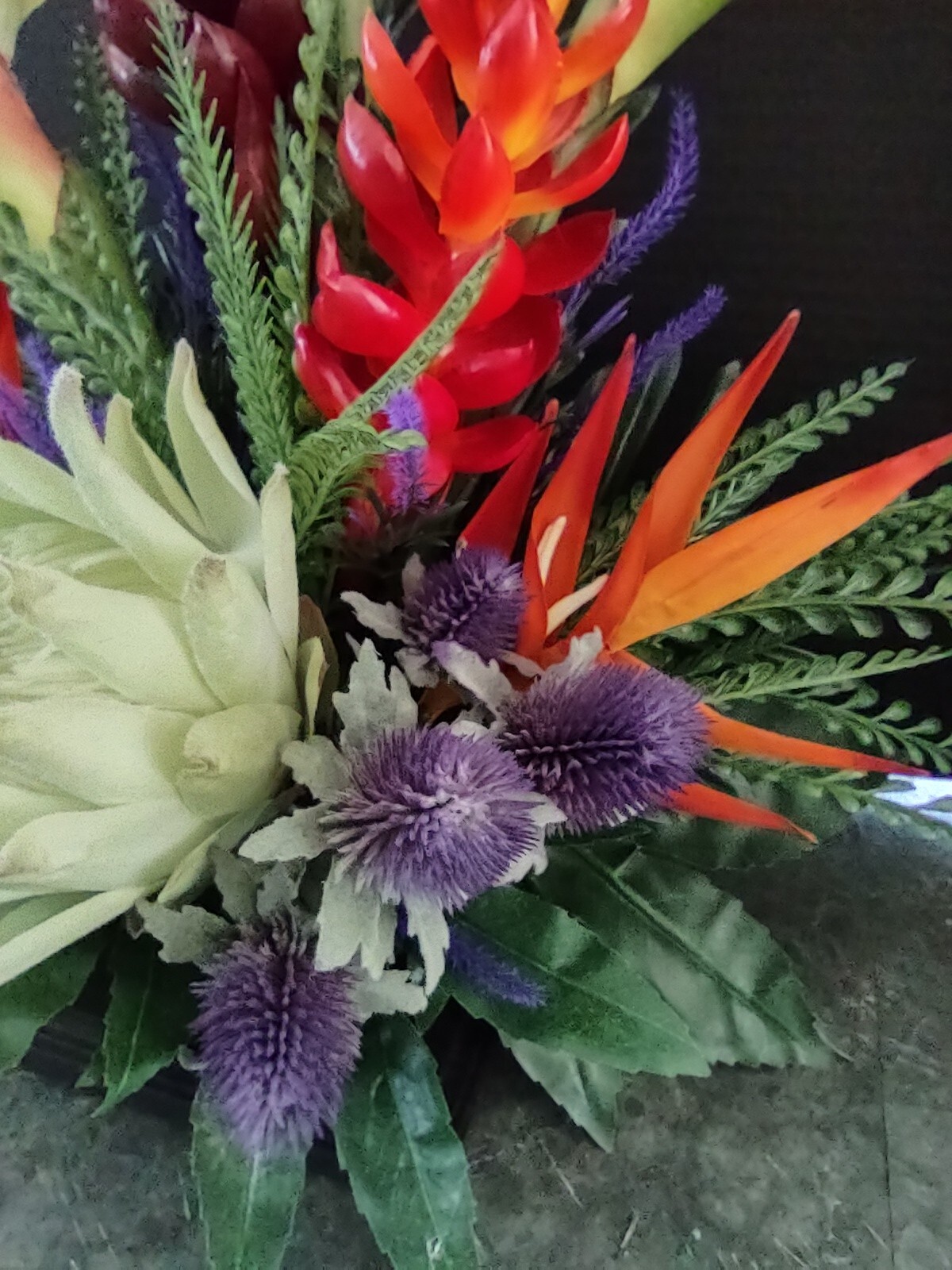 Artificia ltropical floral arrangement